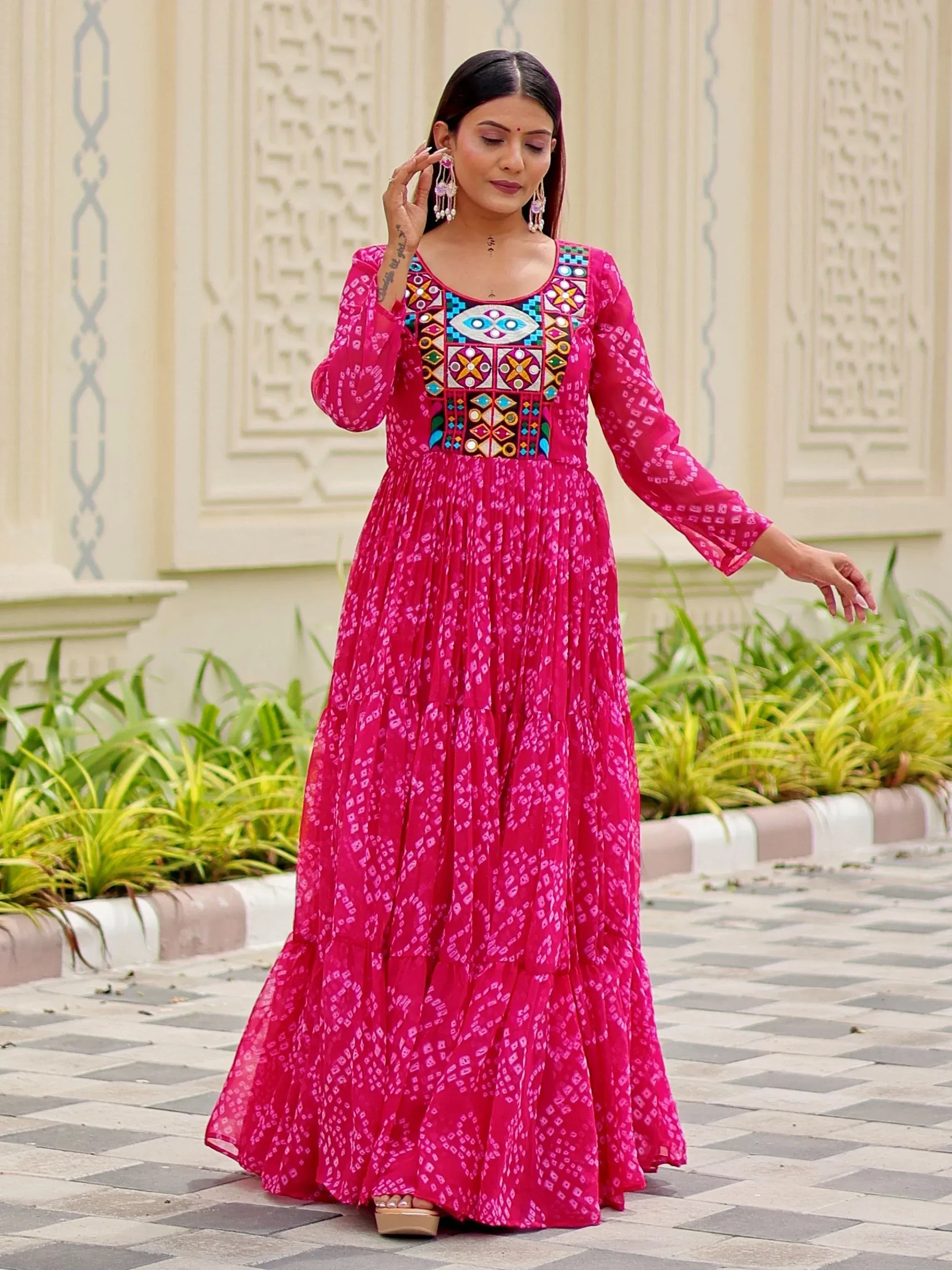 Pink ethnic gown with mirror work and geometric embroidery, perfect for Indian festive occasions