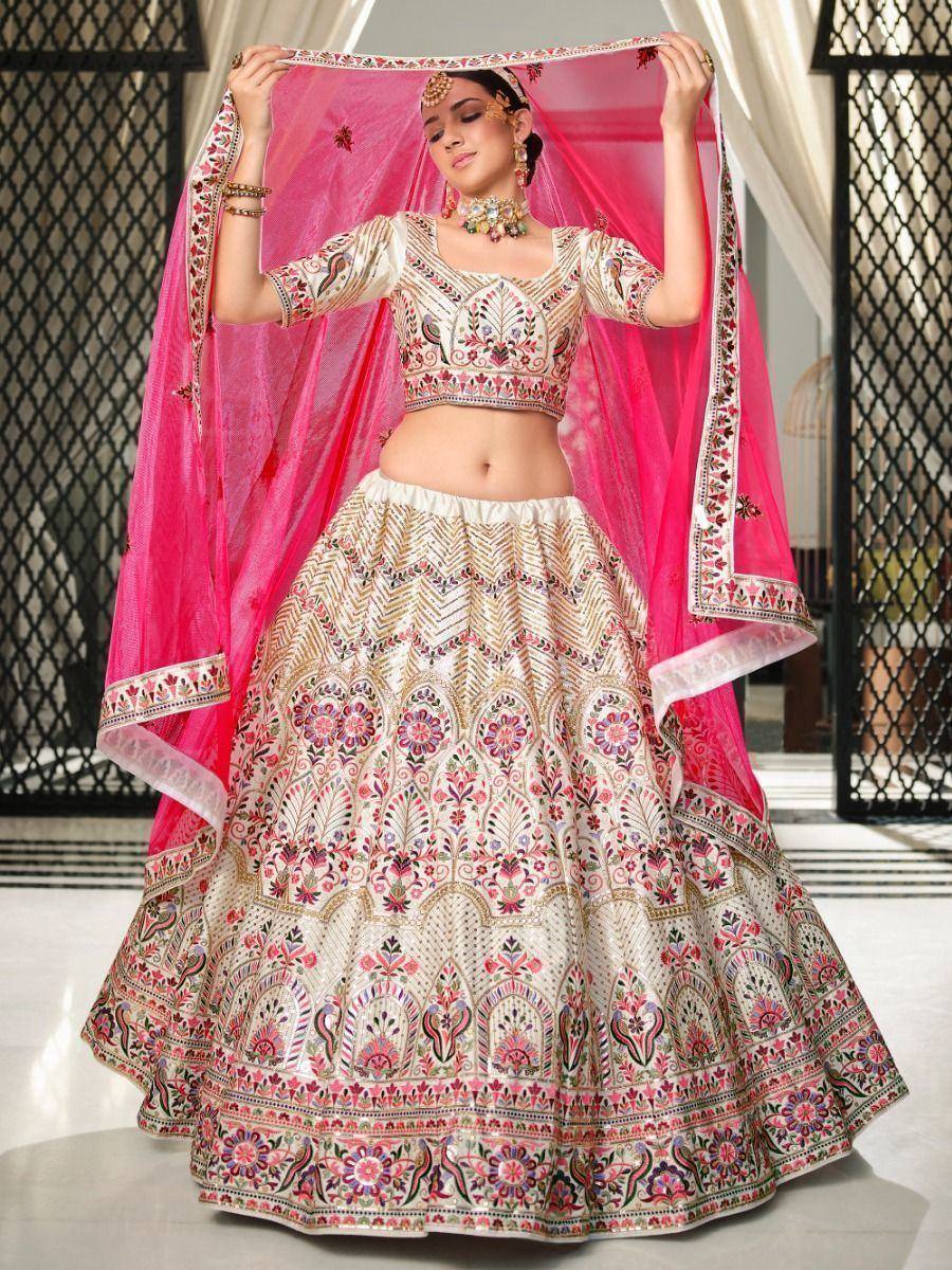 Designer lehenga choli with intricate floral embroidery and pink dupatta, perfect for Indian ethnic occasions