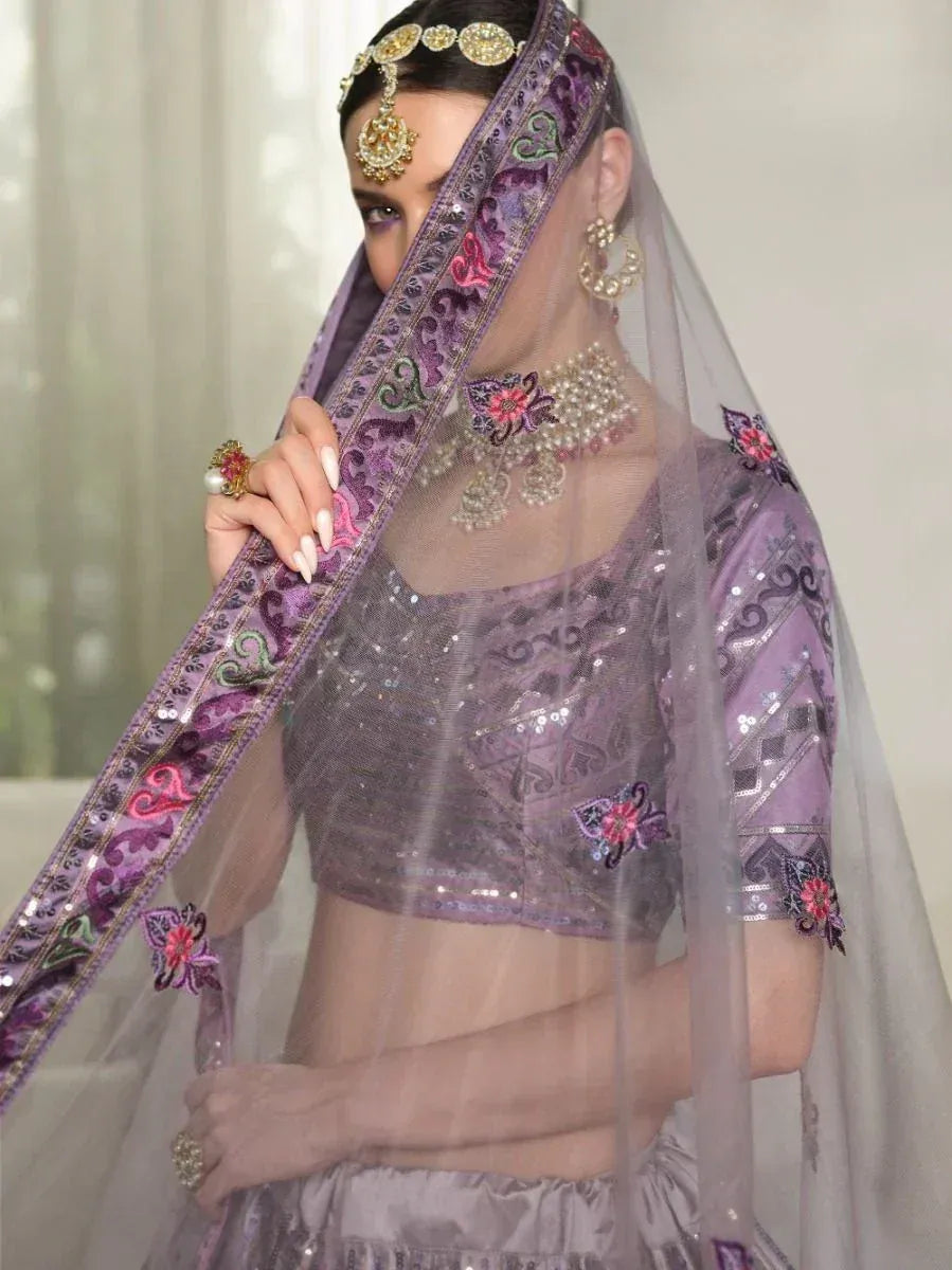 Purple sequin lehenga choli with floral embroidery and sheer dupatta, perfect for Indian ethnic wear occasions.