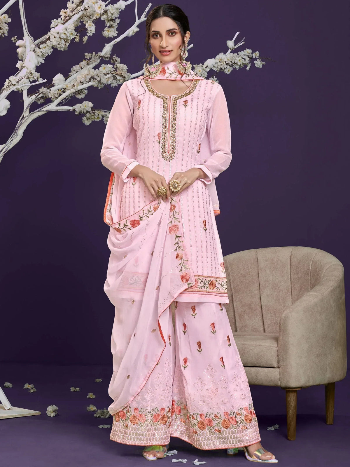 Pink embroidered salwar kameez with floral design, perfect for ethnic occasions