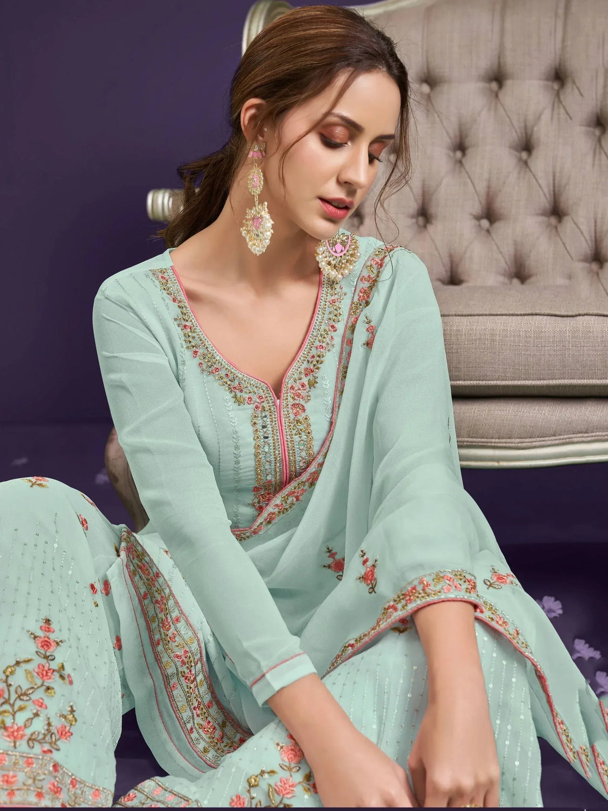 Mint green embroidered salwar kameez with pink floral detailing, perfect for ethnic occasions