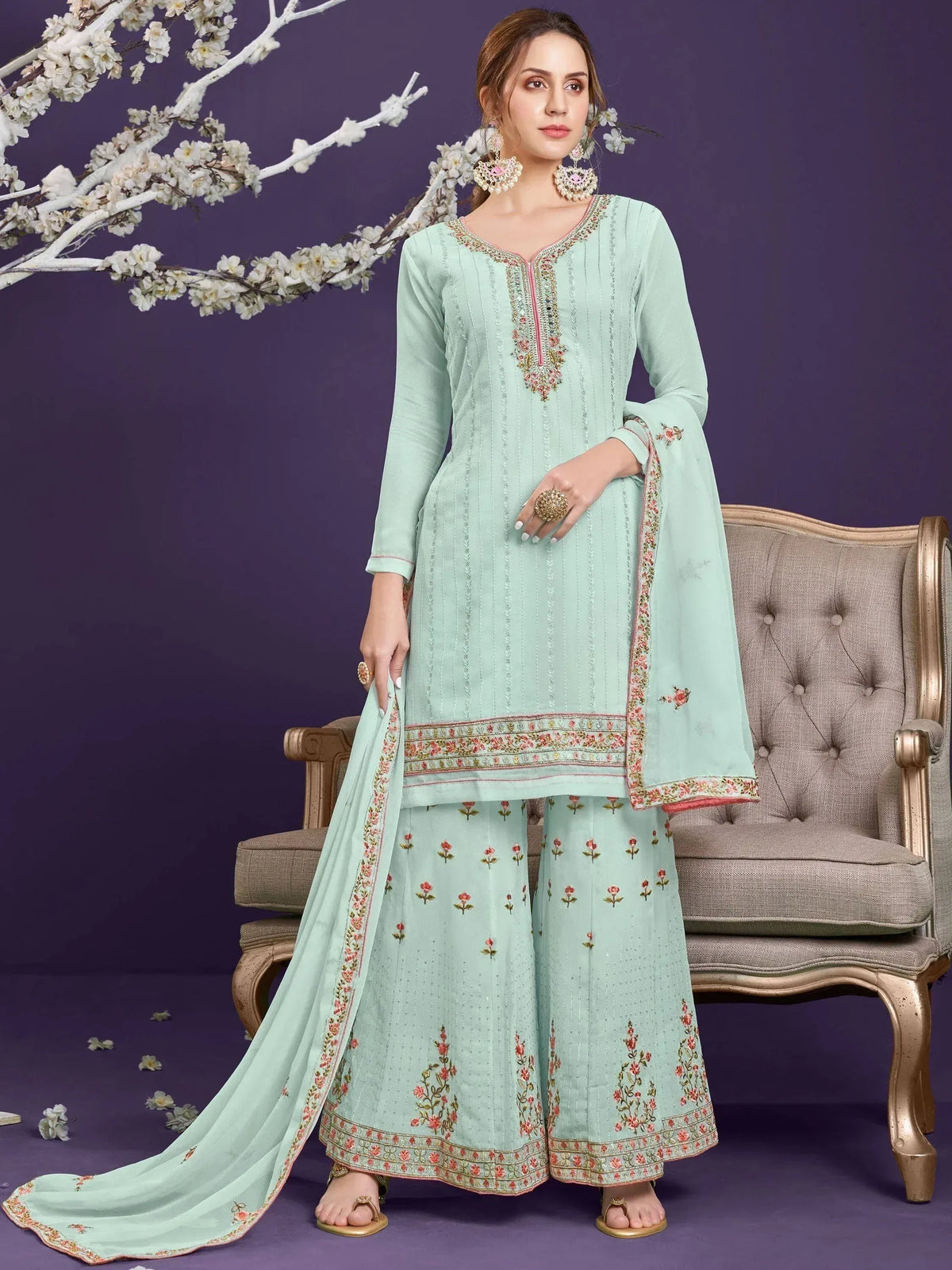 Mint green embroidered salwar kameez with floral dupatta, perfect for Indian ethnic wear occasions.