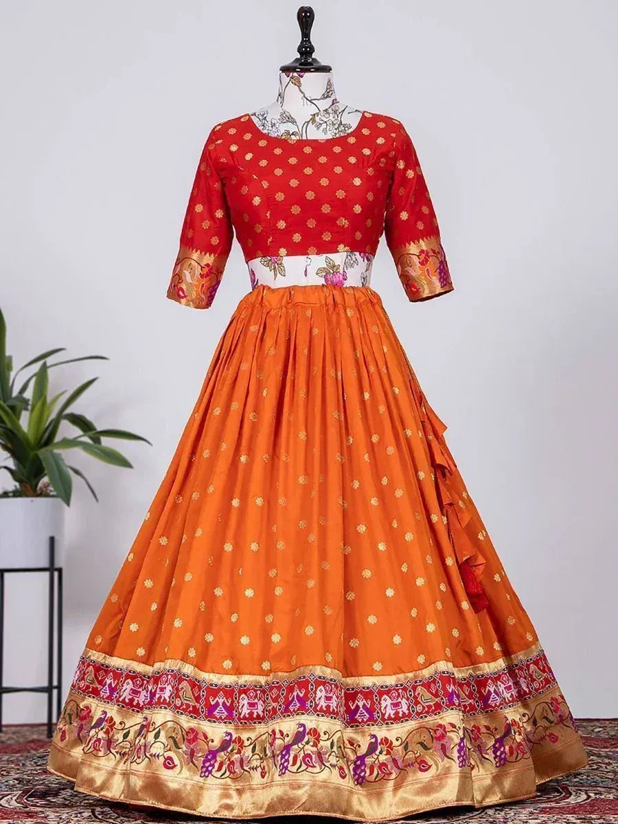 Red and orange ethnic lehenga choli with floral print and embroidered border, perfect for Indian weddings and festivals