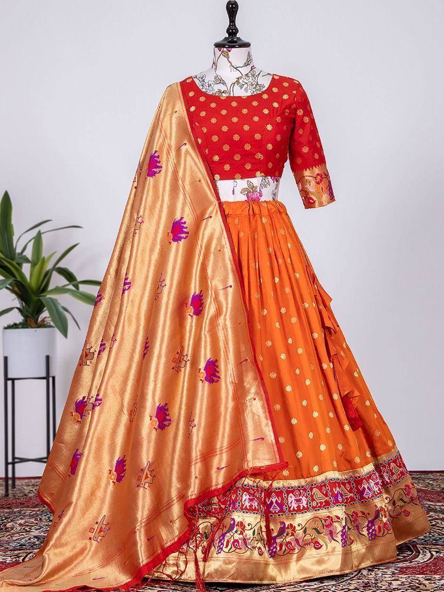 Red and orange ethnic lehenga choli with gold embroidery and printed dupatta, perfect for Indian weddings and festivals
