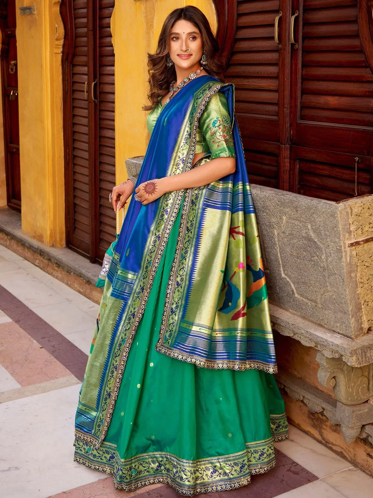 Green and blue designer lehenga choli with peacock print and embroidered dupatta, perfect for Indian ethnic wear.