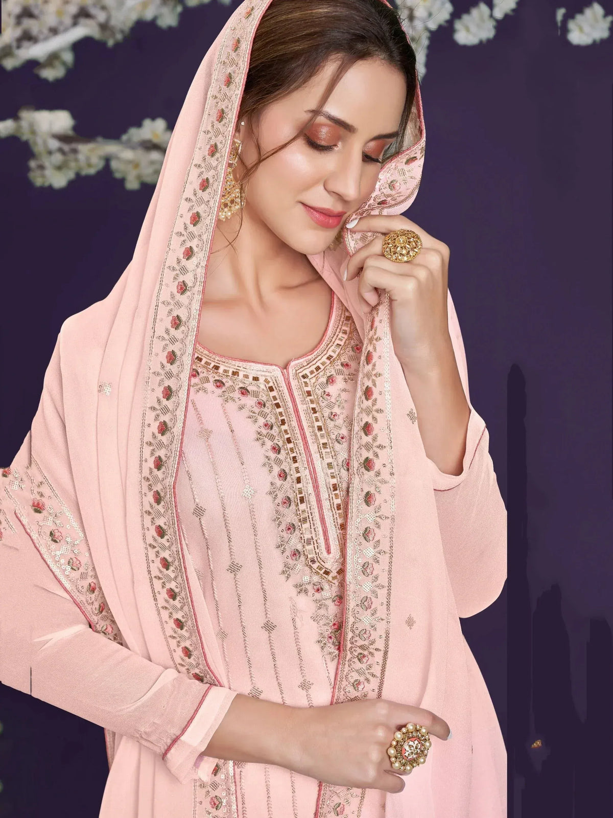 Pink embroidered salwar kameez with floral dupatta, perfect for Indian ethnic wear occasions.