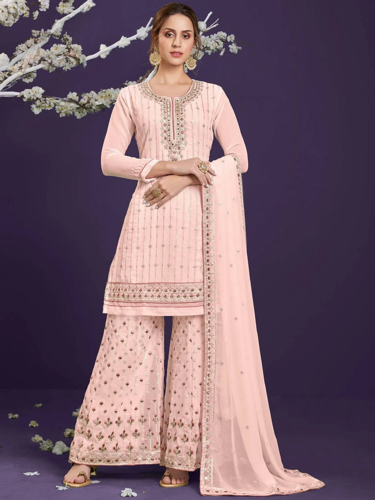 Elegant pink embroidered salwar kameez with floral detailing and matching dupatta for ethnic wear