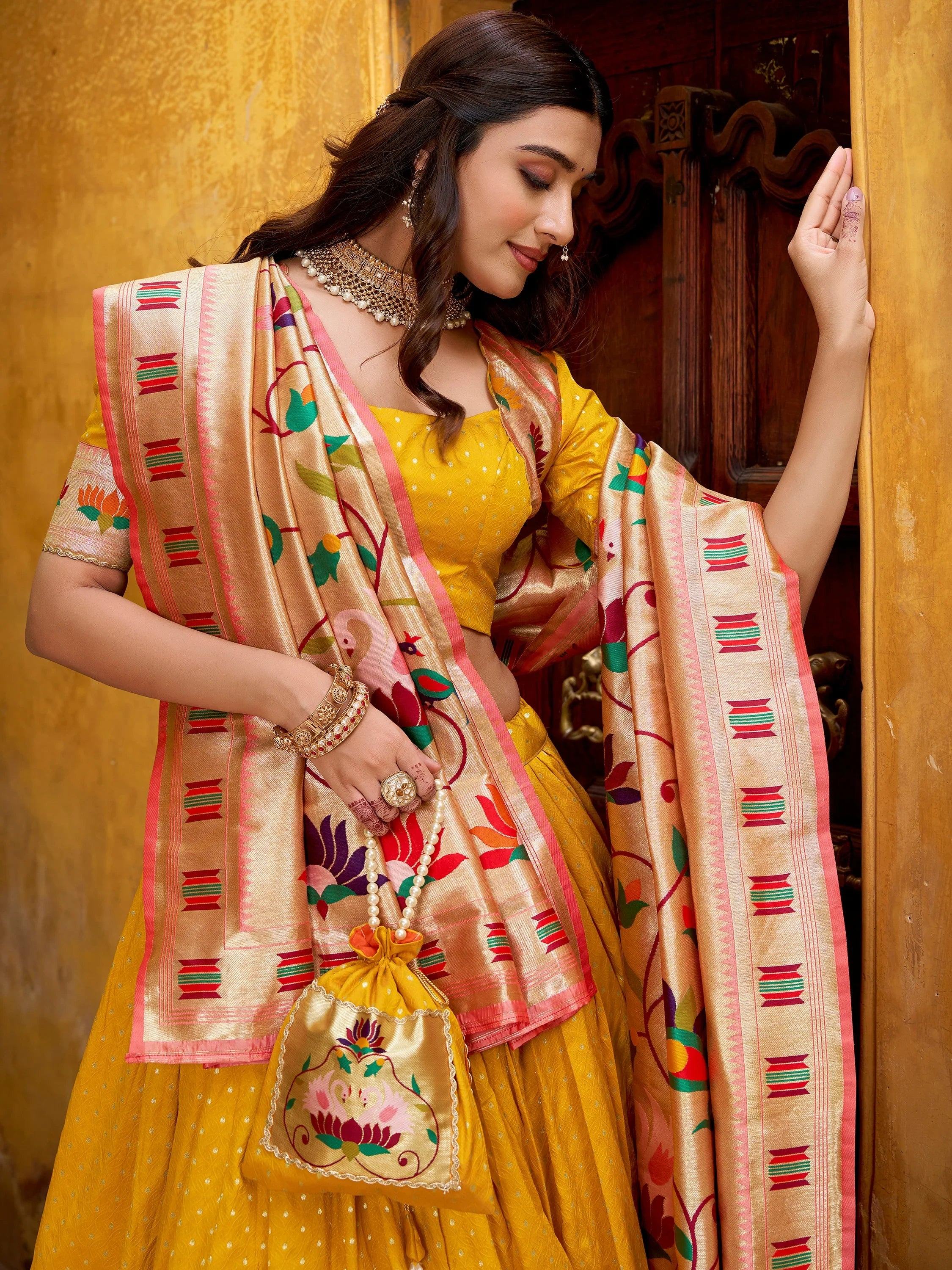 Charming Yellow Zari Weaving Silk Wedding Wear Lehenga Choli