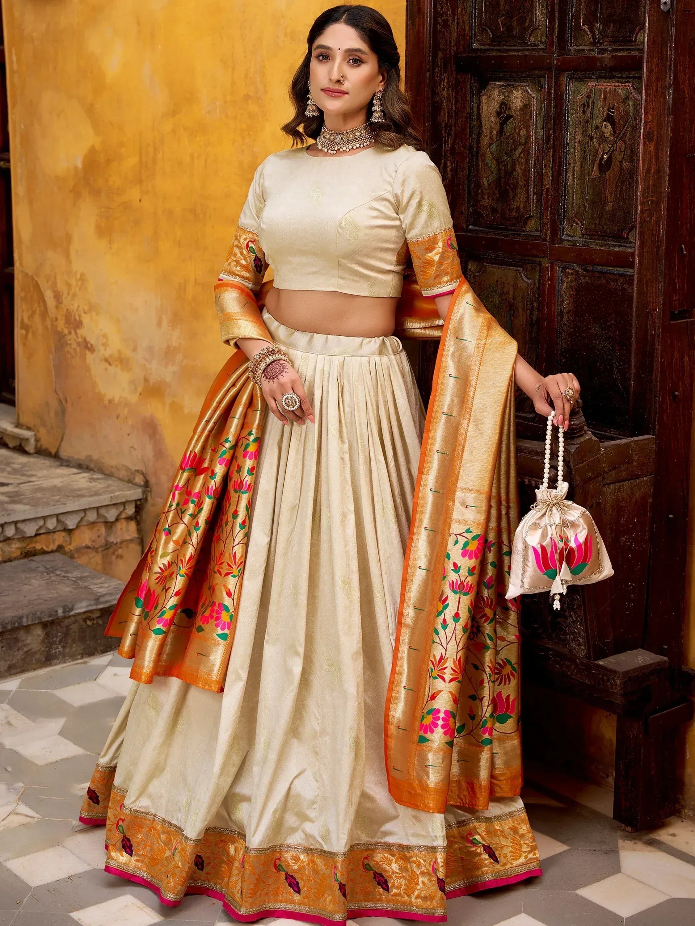 Dazzling Off-White Zari Weaving Silk Function Wear Lehenga Choli