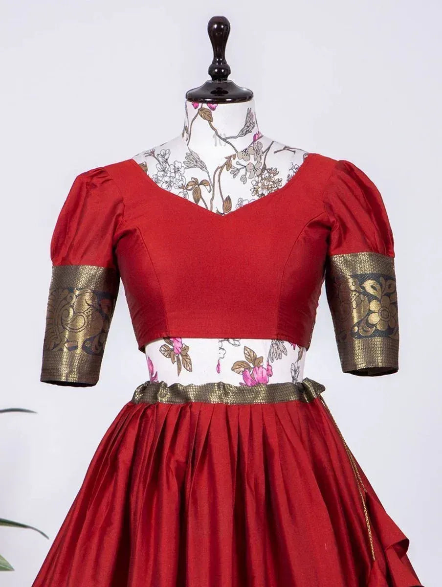 Red ethnic gown with gold embroidered sleeves and floral print waistband, perfect for Indian festive occasions