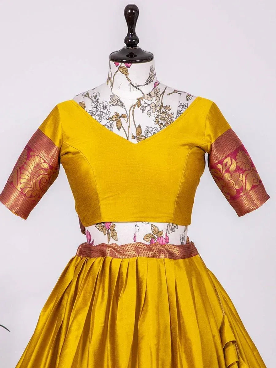 Mustard yellow lehenga choli with gold and pink brocade sleeves, perfect for Indian ethnic wear occasions