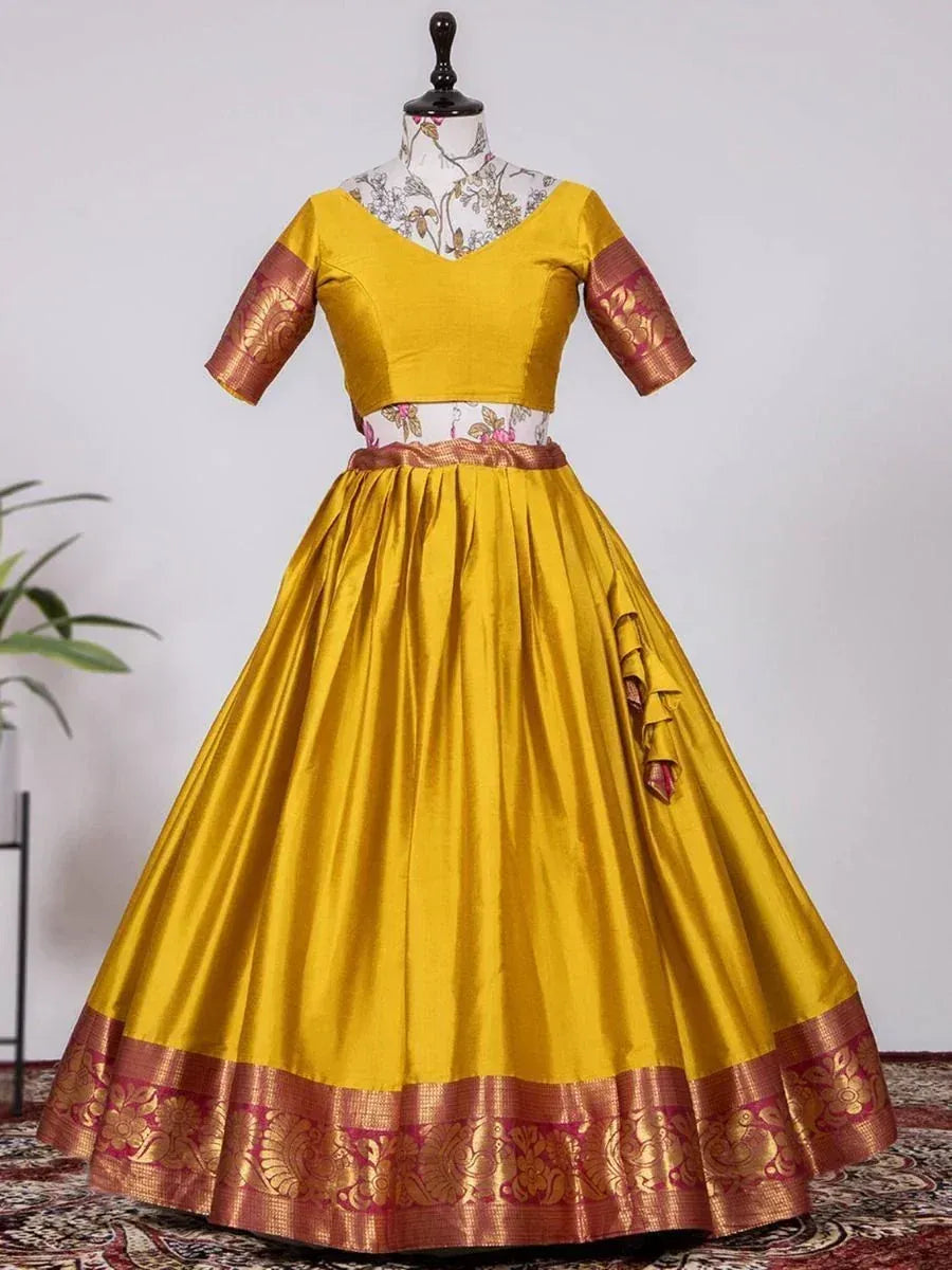Mustard yellow ethnic lehenga choli with gold brocade border and floral blouse, perfect for Indian weddings and festivals