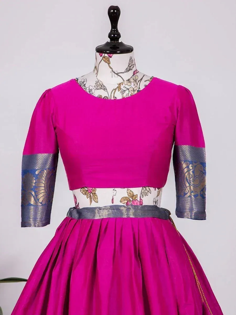 Fuchsia ethnic gown with floral print waistband and blue-gold sleeve accents, perfect for Indian occasions
