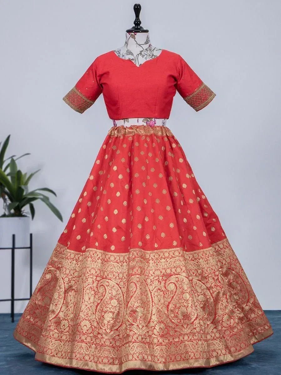 Red and gold ethnic lehenga choli with intricate paisley border, perfect for Indian weddings and festivals