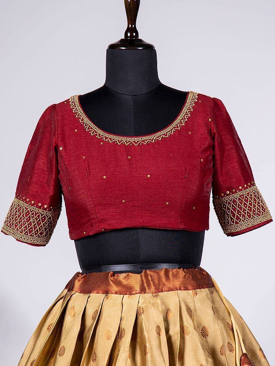 Maroon embroidered blouse with gold detailing paired with golden lehenga, ideal for Indian ethnic wear