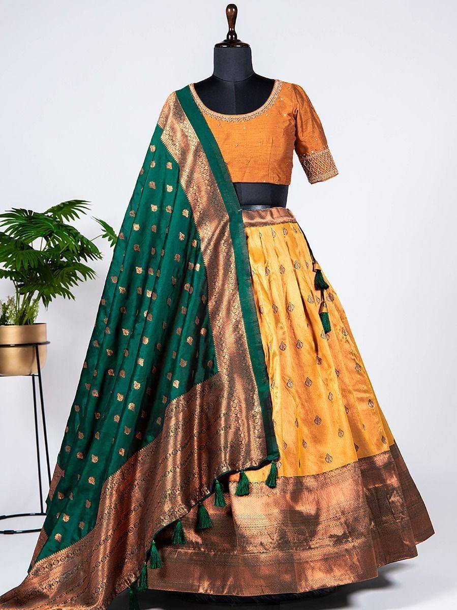 Orange and green designer lehenga choli with gold embroidery and tassels, ethnic wear for women