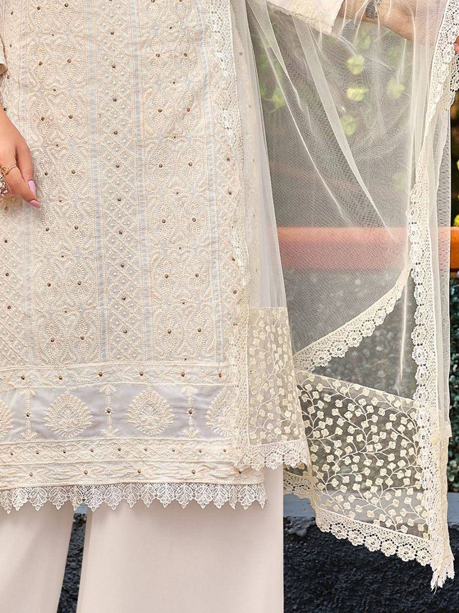 Elegant cream embroidered salwar kameez with lace detailing and sheer dupatta