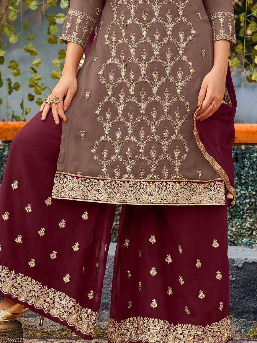 Woman wearing maroon palazzo suit with gold embroidery, traditional Indian ethnic wear