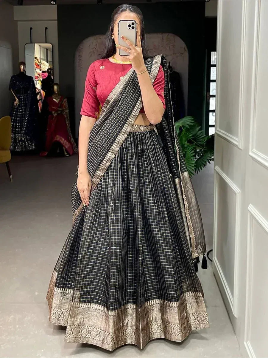 Black and gold checkered lehenga choli with embroidered border, perfect for Indian ethnic wear occasions