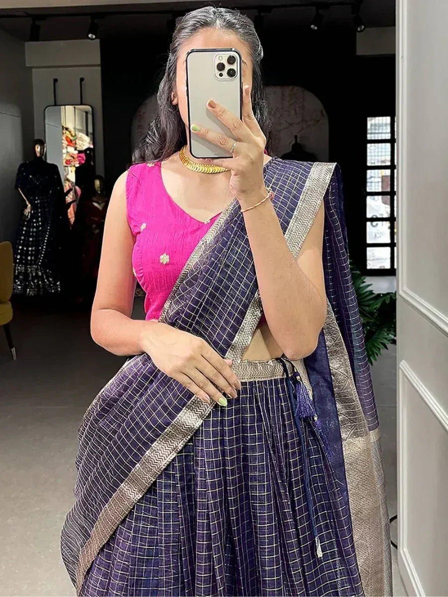 Woman in purple checkered saree with pink blouse, ethnic Indian wear, mirror selfie in boutique