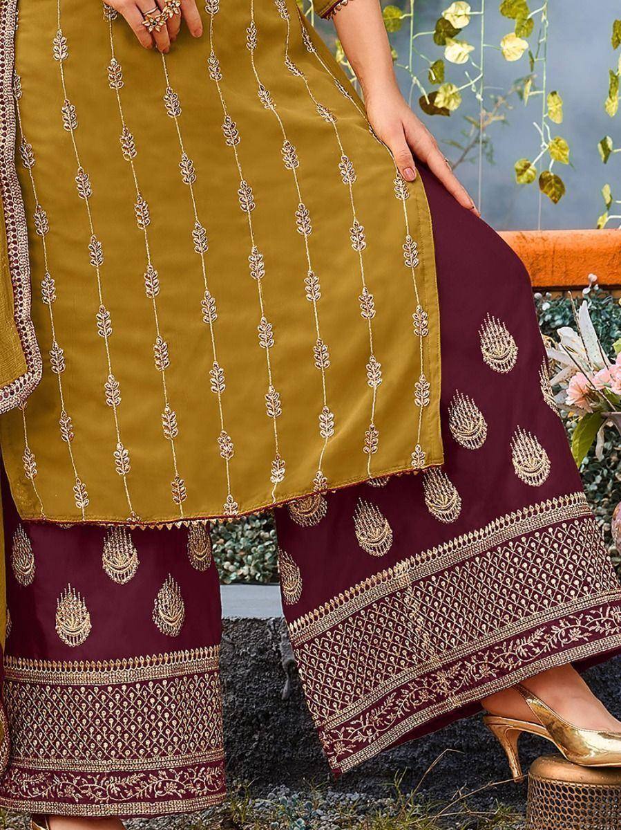 Mustard and maroon embroidered salwar kameez with gold detailing, perfect for ethnic occasions