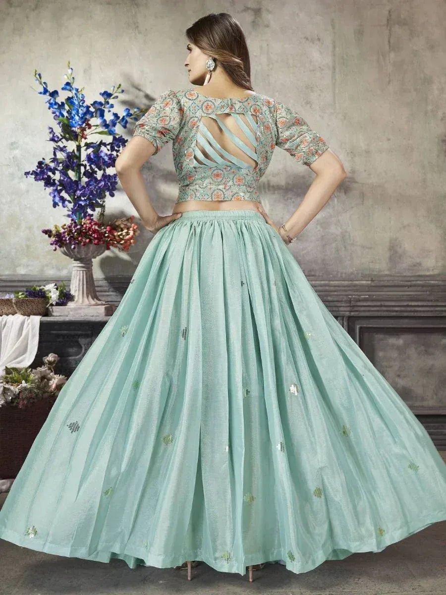 Mint green lehenga choli with floral blouse and cut-out back, perfect for Indian ethnic occasions