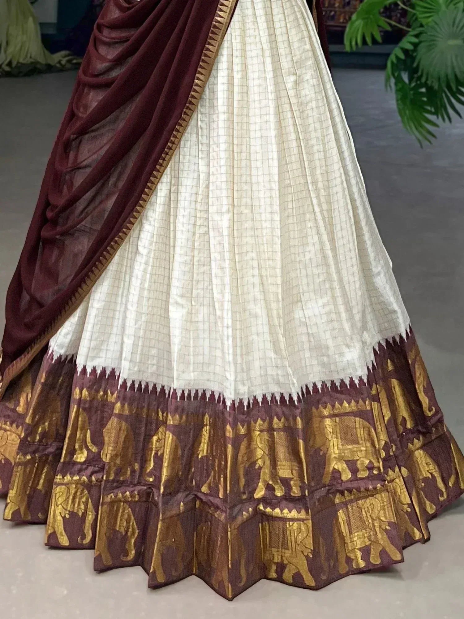 White and maroon lehenga with golden elephant print border, ethnic Indian wear