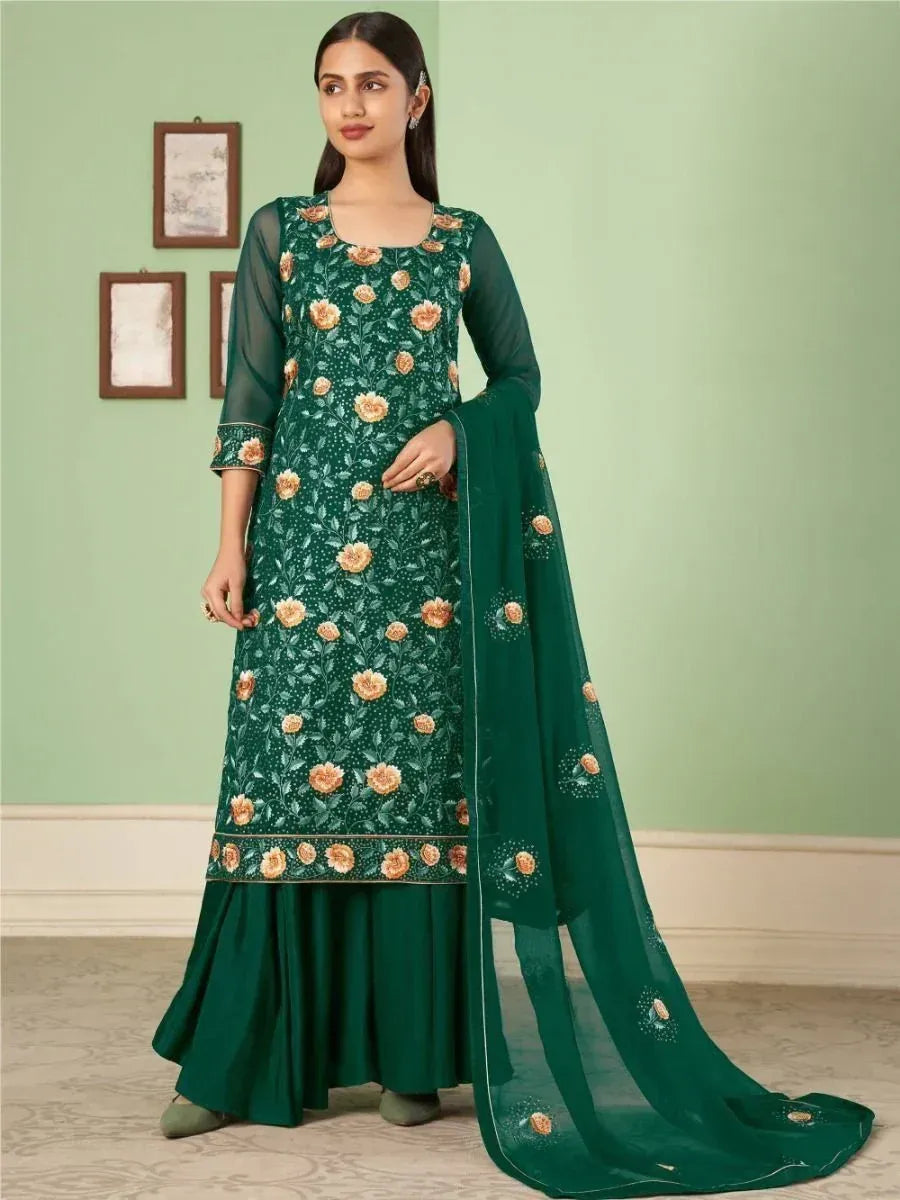Woman wearing green ethnic salwar kameez with floral embroidery and matching dupatta