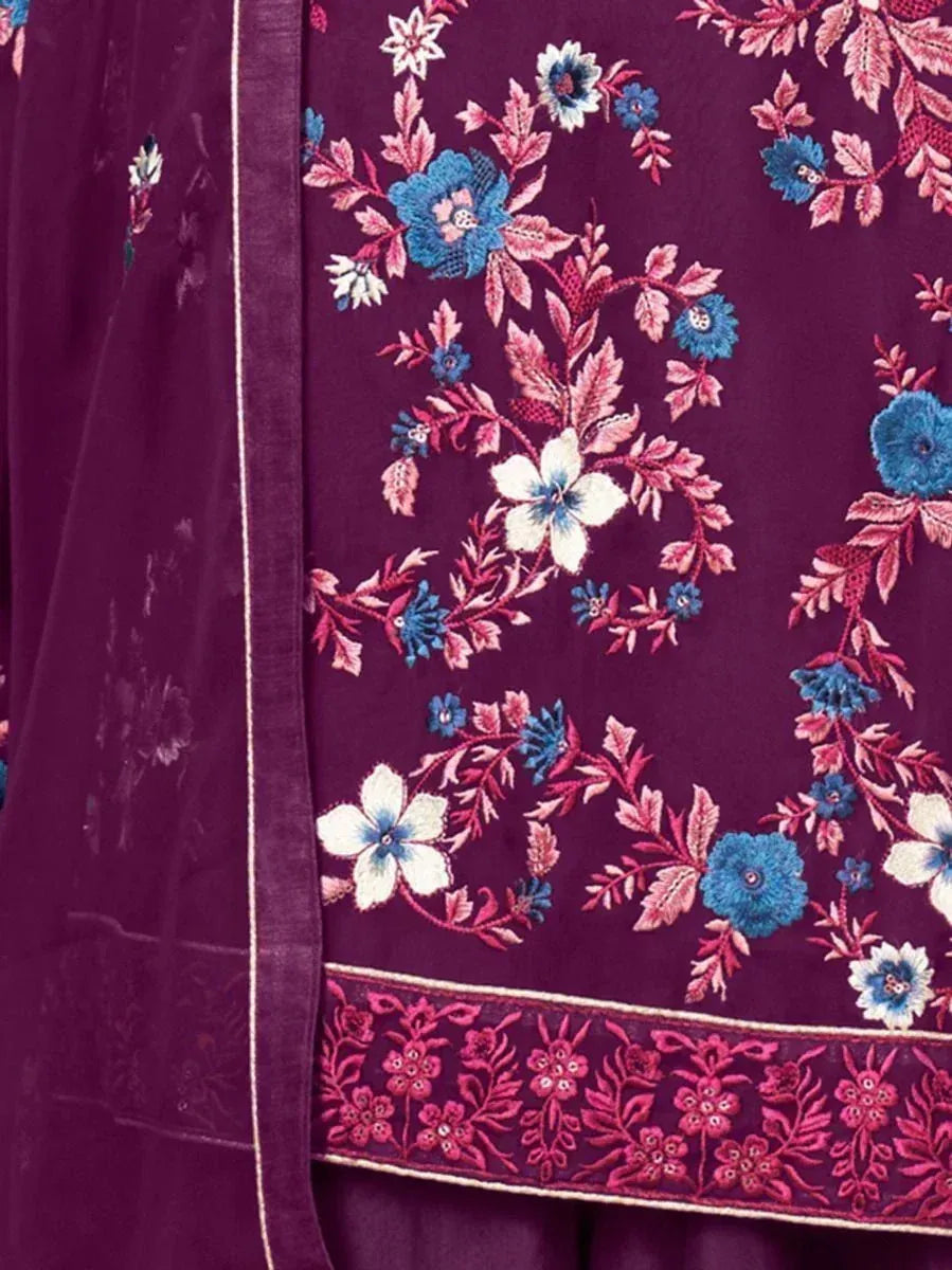 Purple ethnic fabric with intricate blue, white, and pink floral embroidery detail