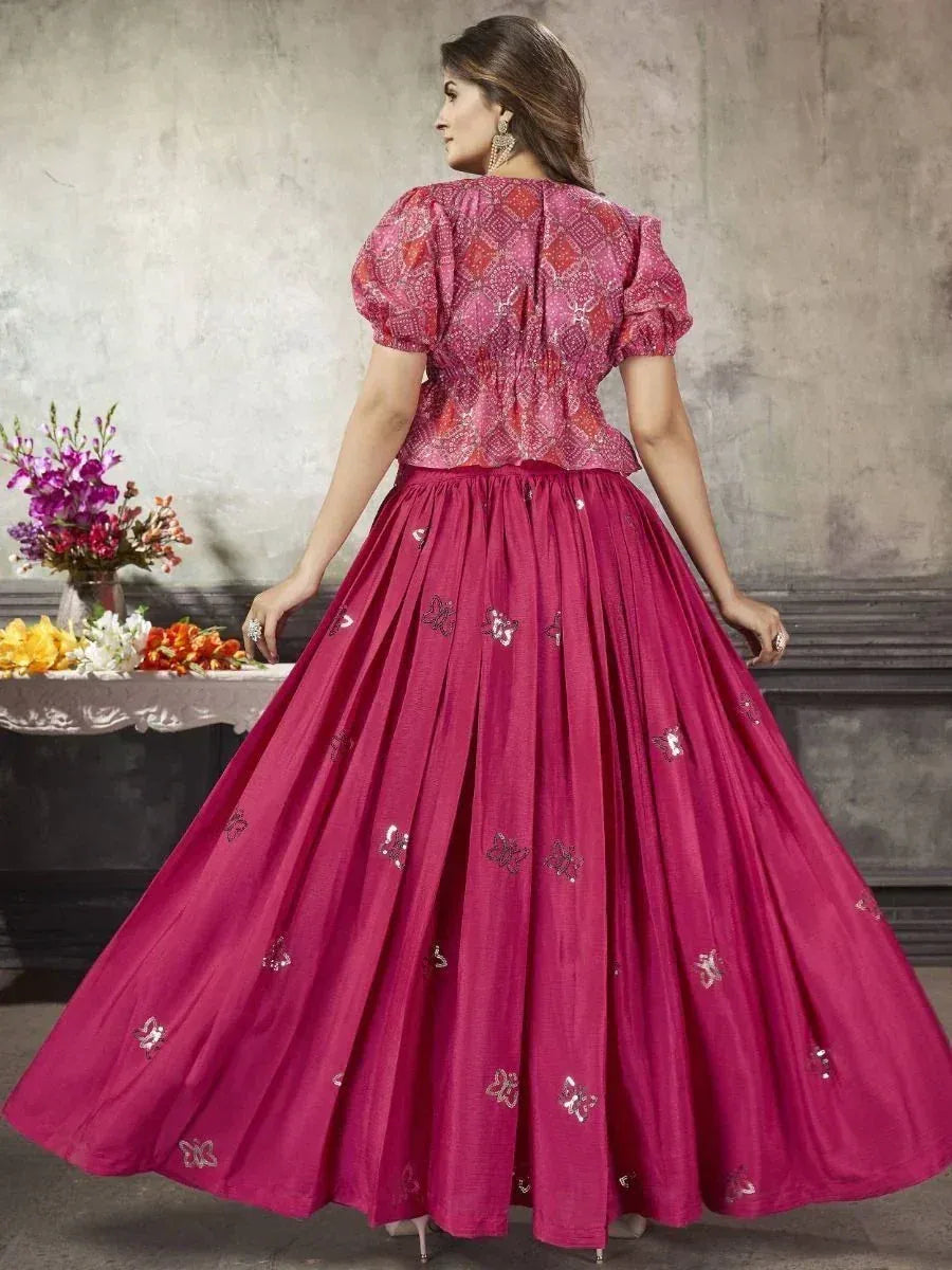 Pink ethnic gown with puff sleeves and butterfly embroidery, perfect for Indian occasions