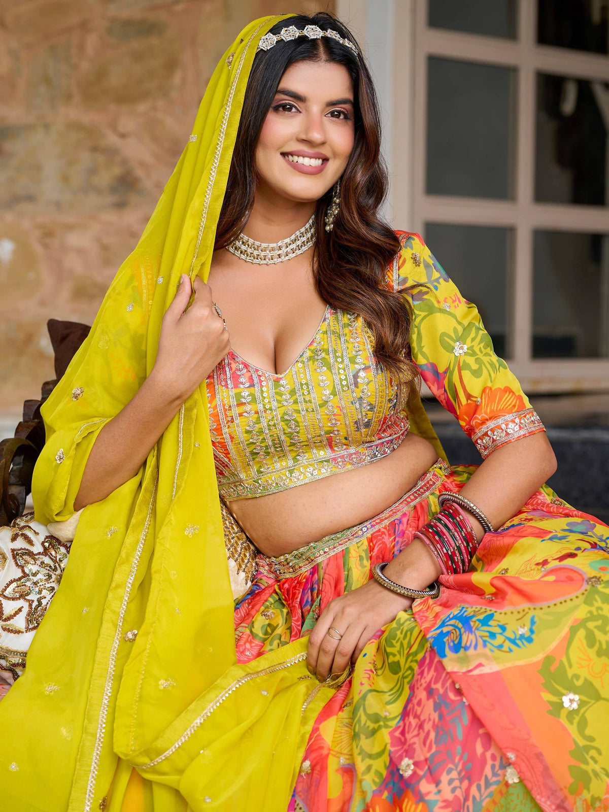 Vibrant yellow and floral printed designer lehenga choli with matching dupatta, perfect for Indian ethnic occasions.