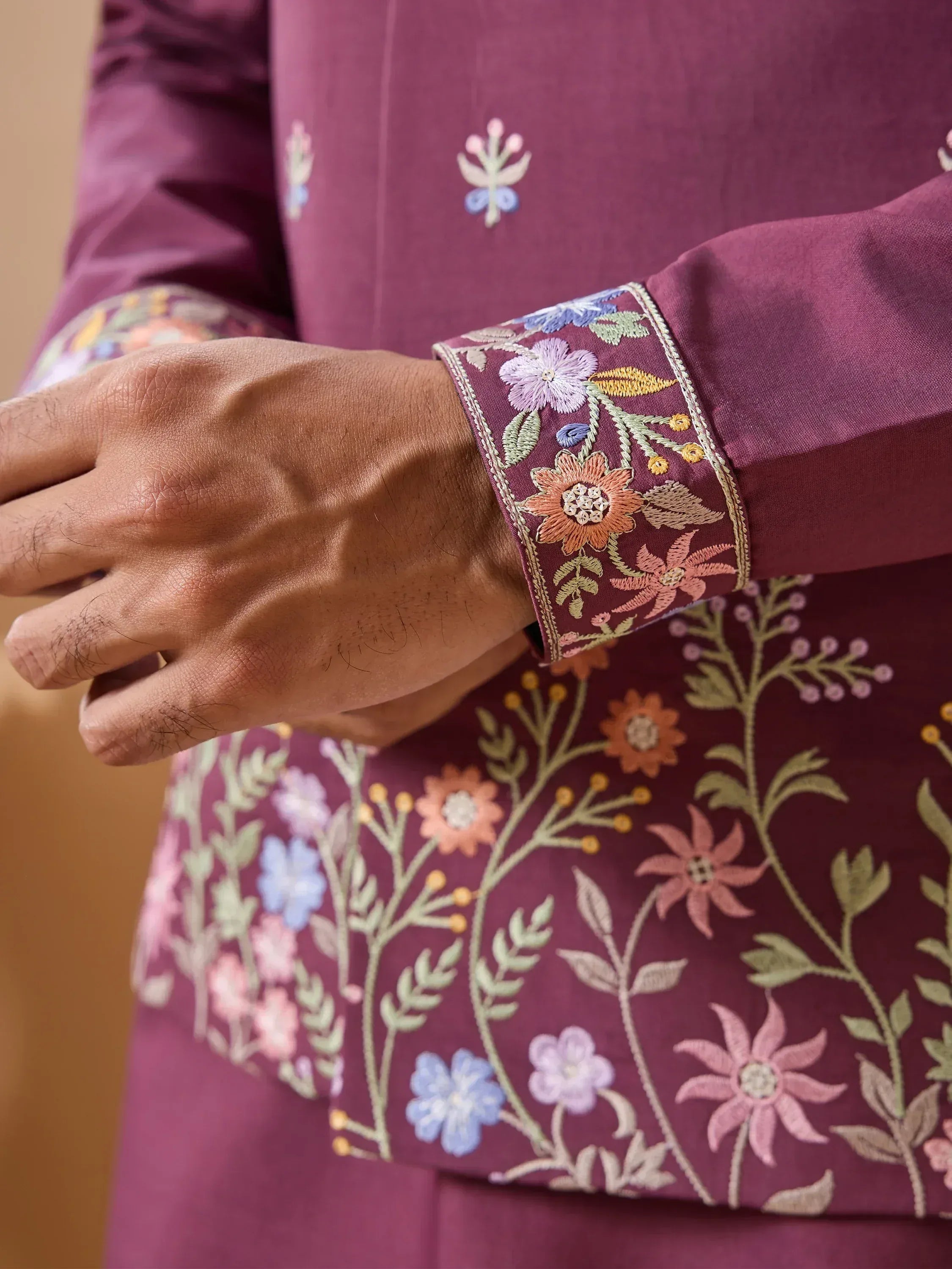 Purple ethnic kurta with floral embroidery on sleeves and cuffs, traditional Indian wear