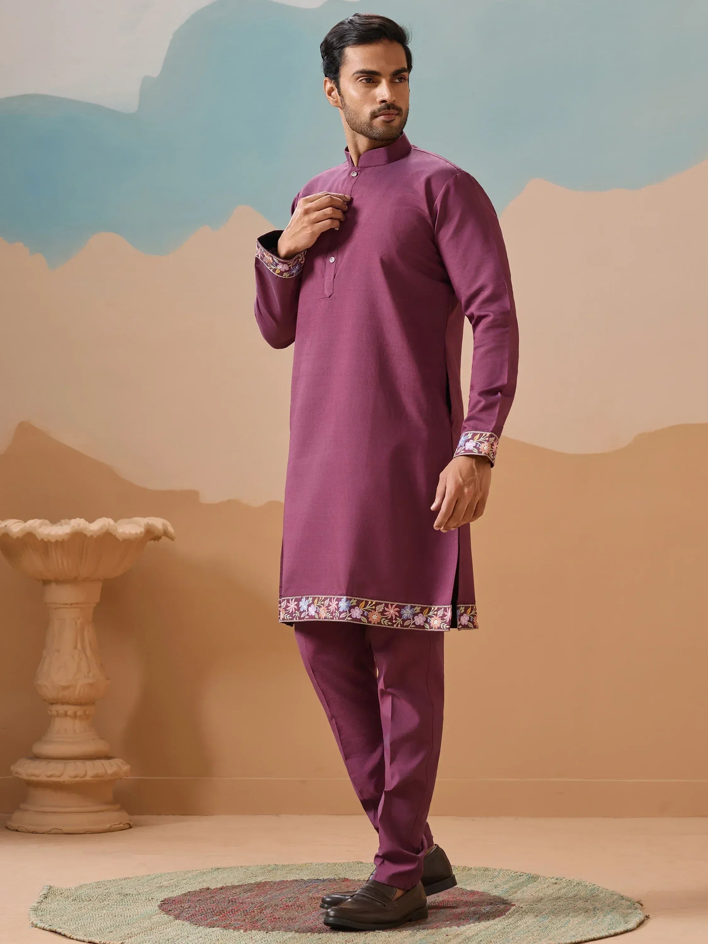 Purple embroidered kurta pajama set with floral detailing, ideal for Indian ethnic wear occasions.