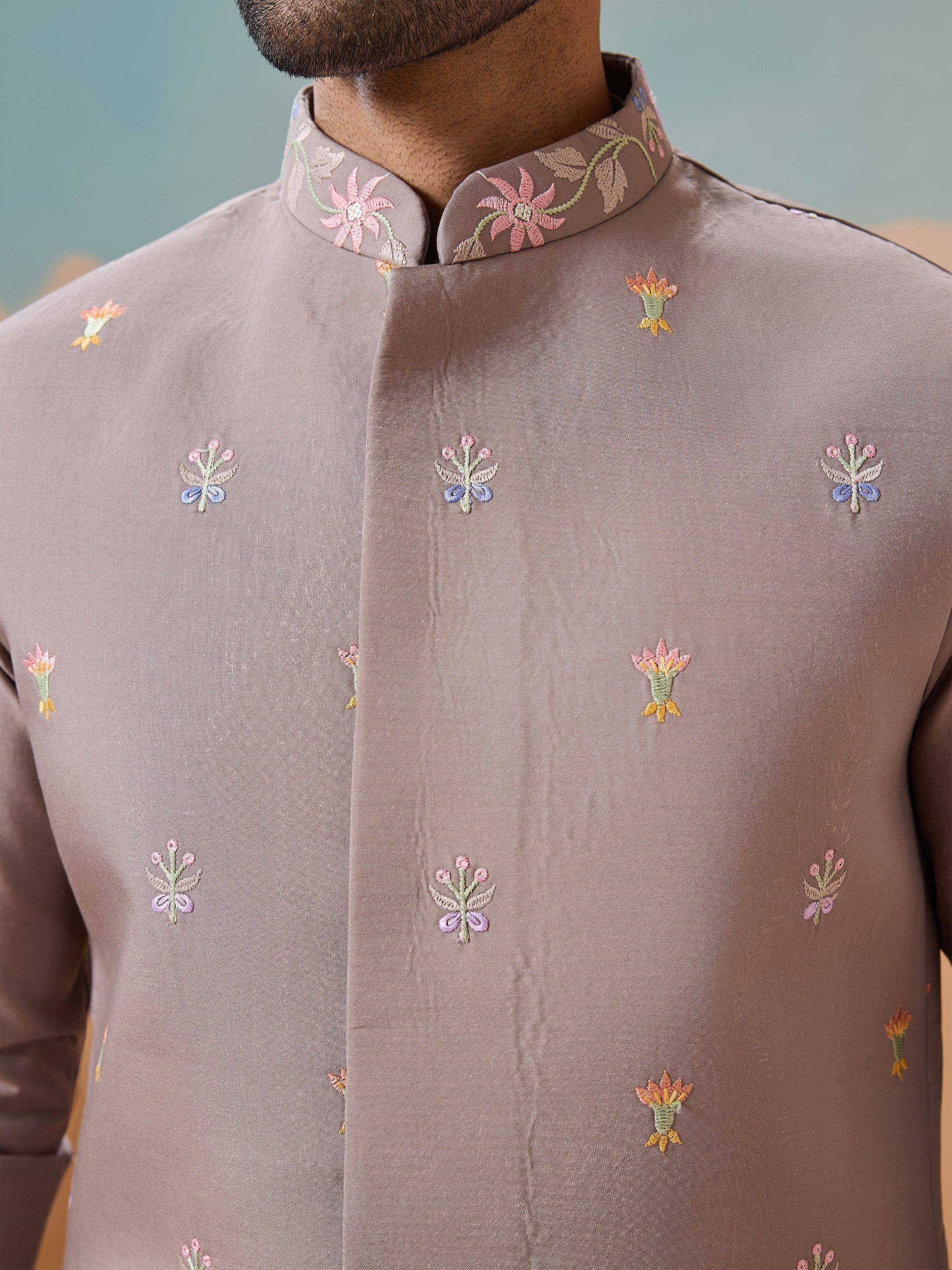 Men's ethnic kurta with floral embroidery, perfect for Indian weddings and festive occasions.