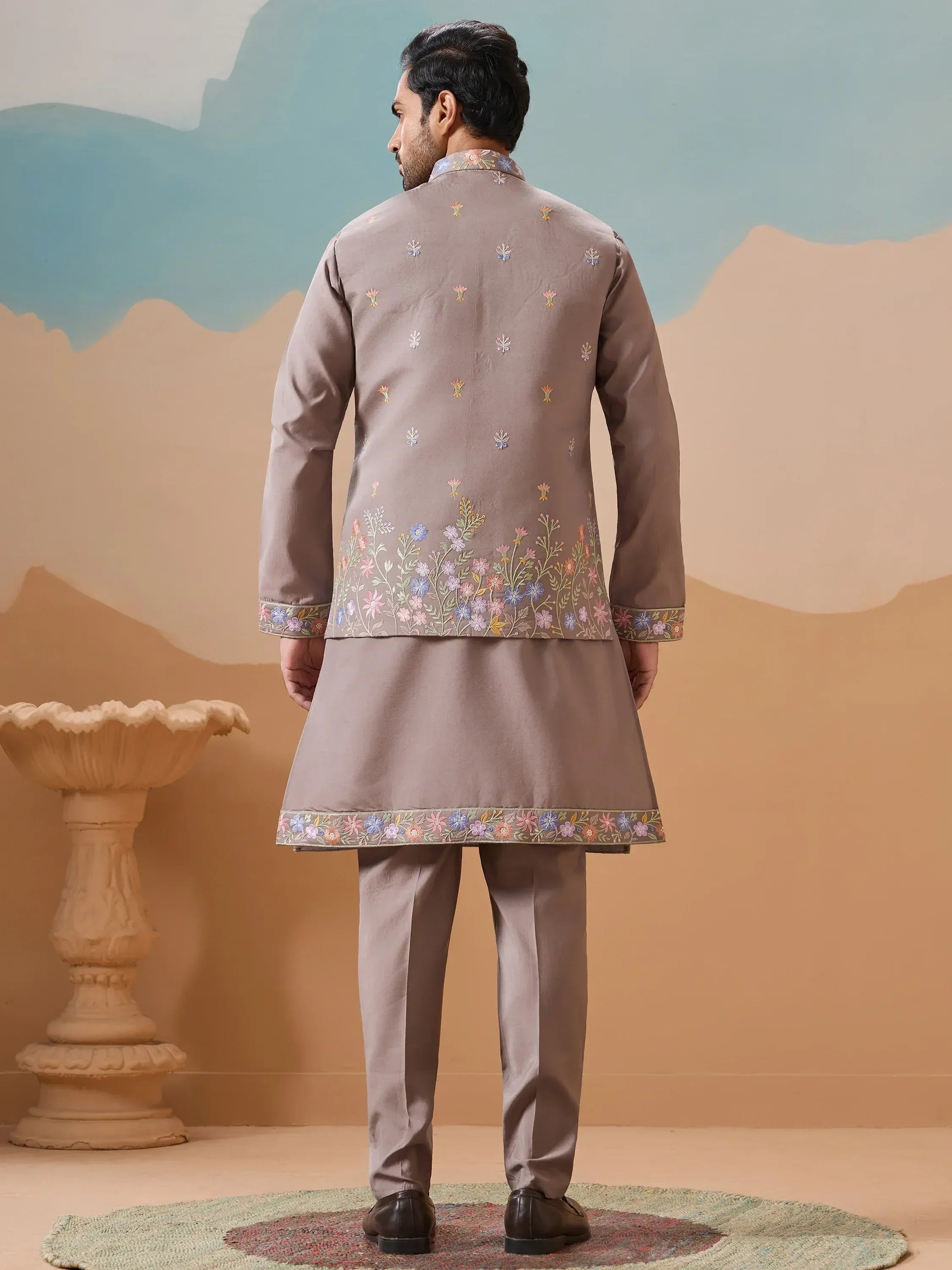 Men's beige embroidered kurta set with floral detailing, perfect for Indian ethnic occasions