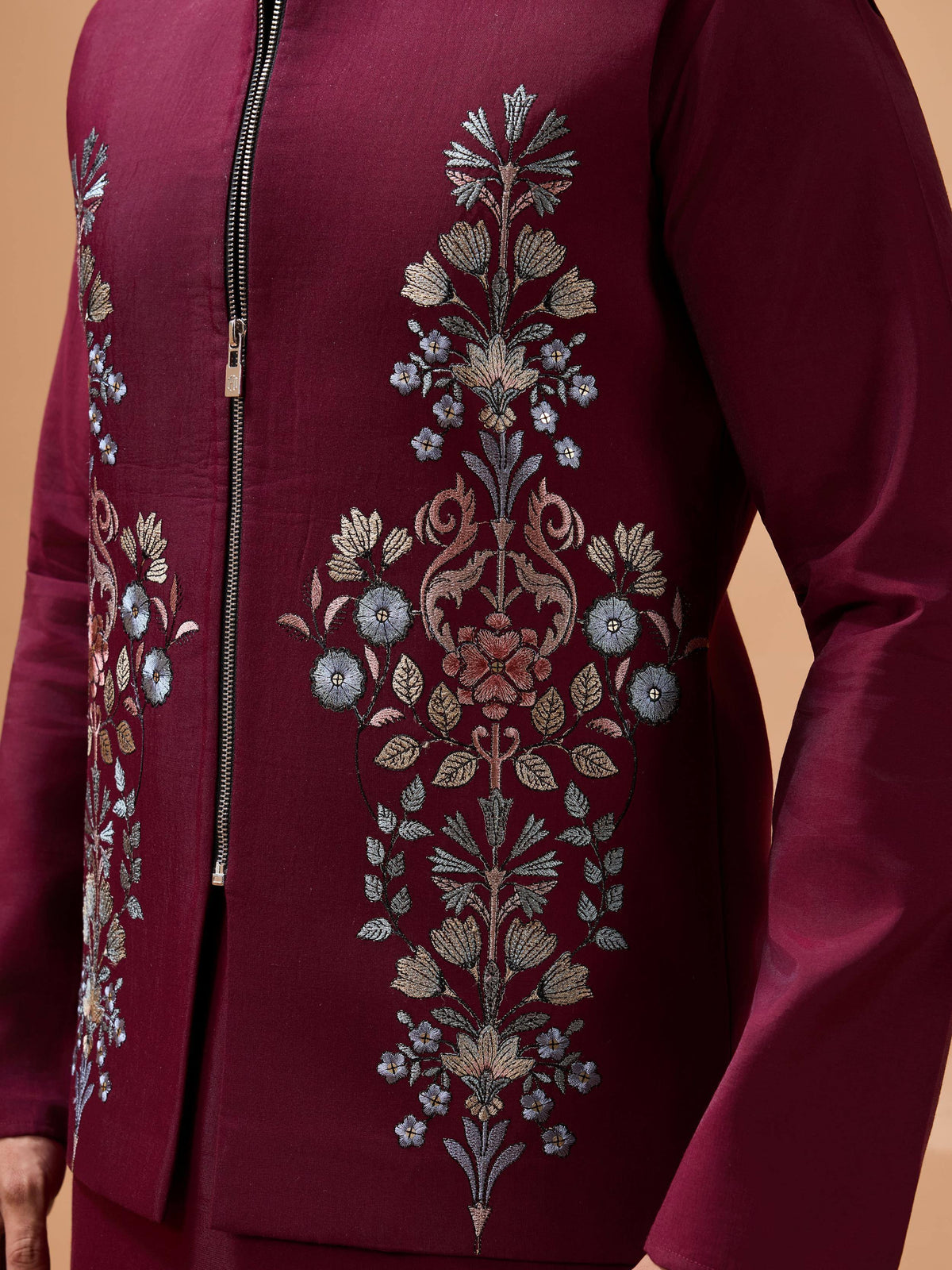 Maroon ethnic jacket with intricate floral embroidery and front zipper, perfect for Indian wear