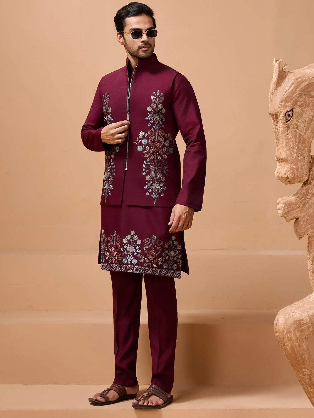 Man in maroon embroidered kurta set with floral design, perfect for Indian ethnic wear occasions