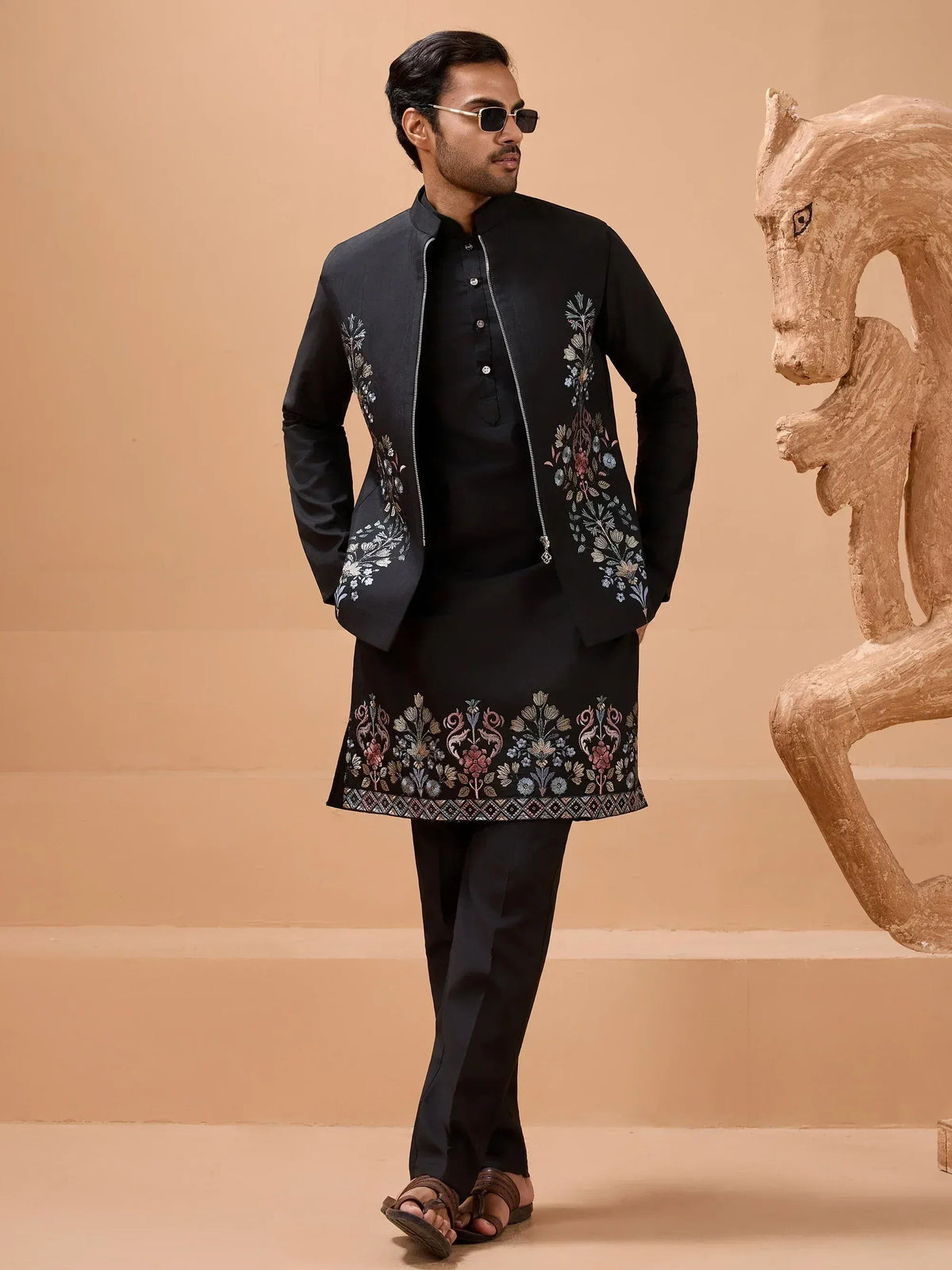 Men's black embroidered kurta set with floral jacket, perfect for Indian ethnic wear occasions.