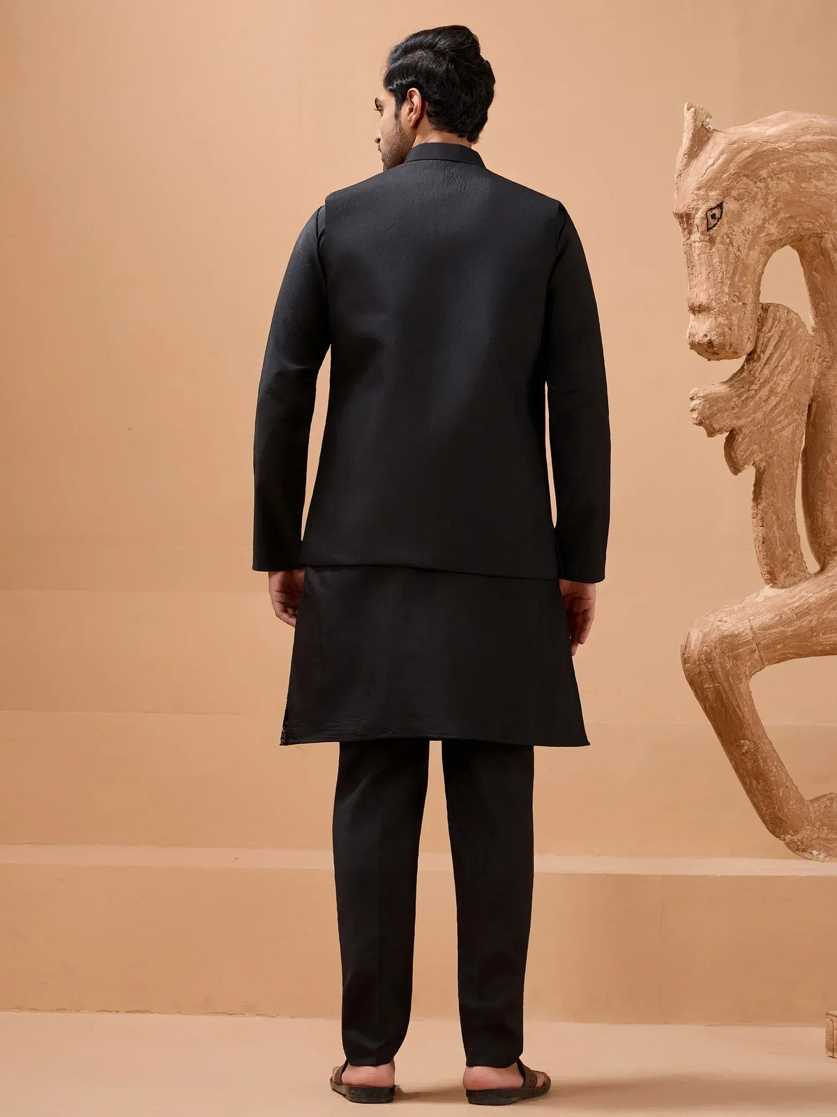 Black men's ethnic kurta set with Nehru jacket, perfect for Indian weddings and formal occasions.