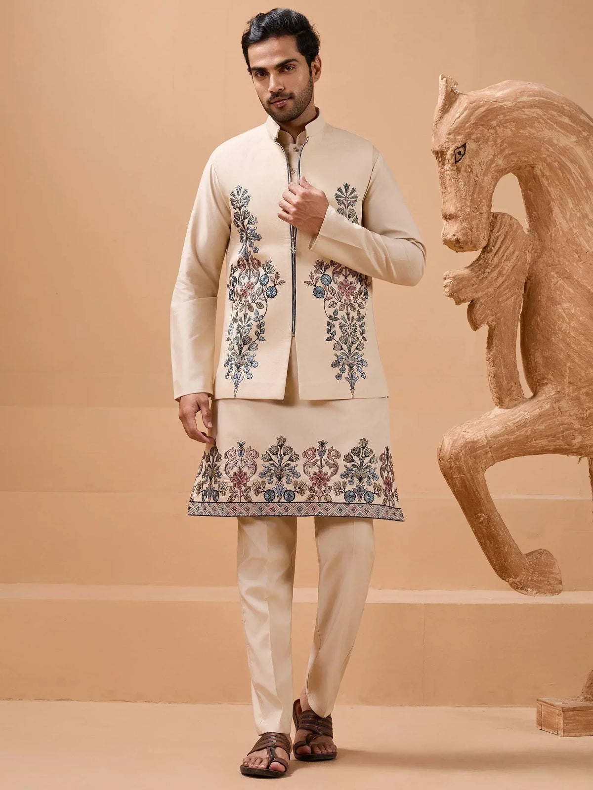 Men's cream embroidered kurta set with floral motifs, perfect for Indian ethnic wear occasions.