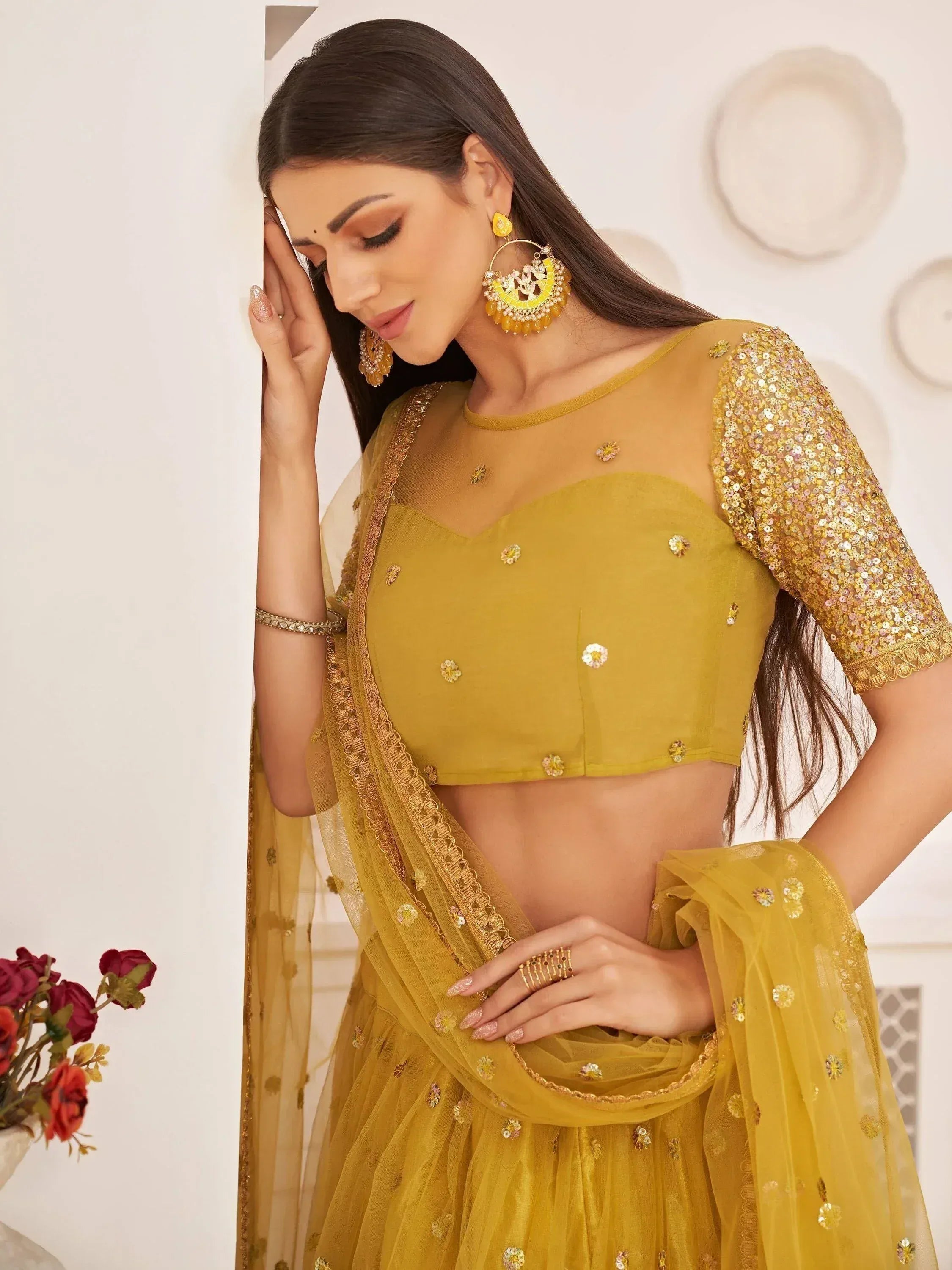 Yellow designer lehenga choli with sequin sleeves and floral embroidery, perfect for Indian ethnic wear