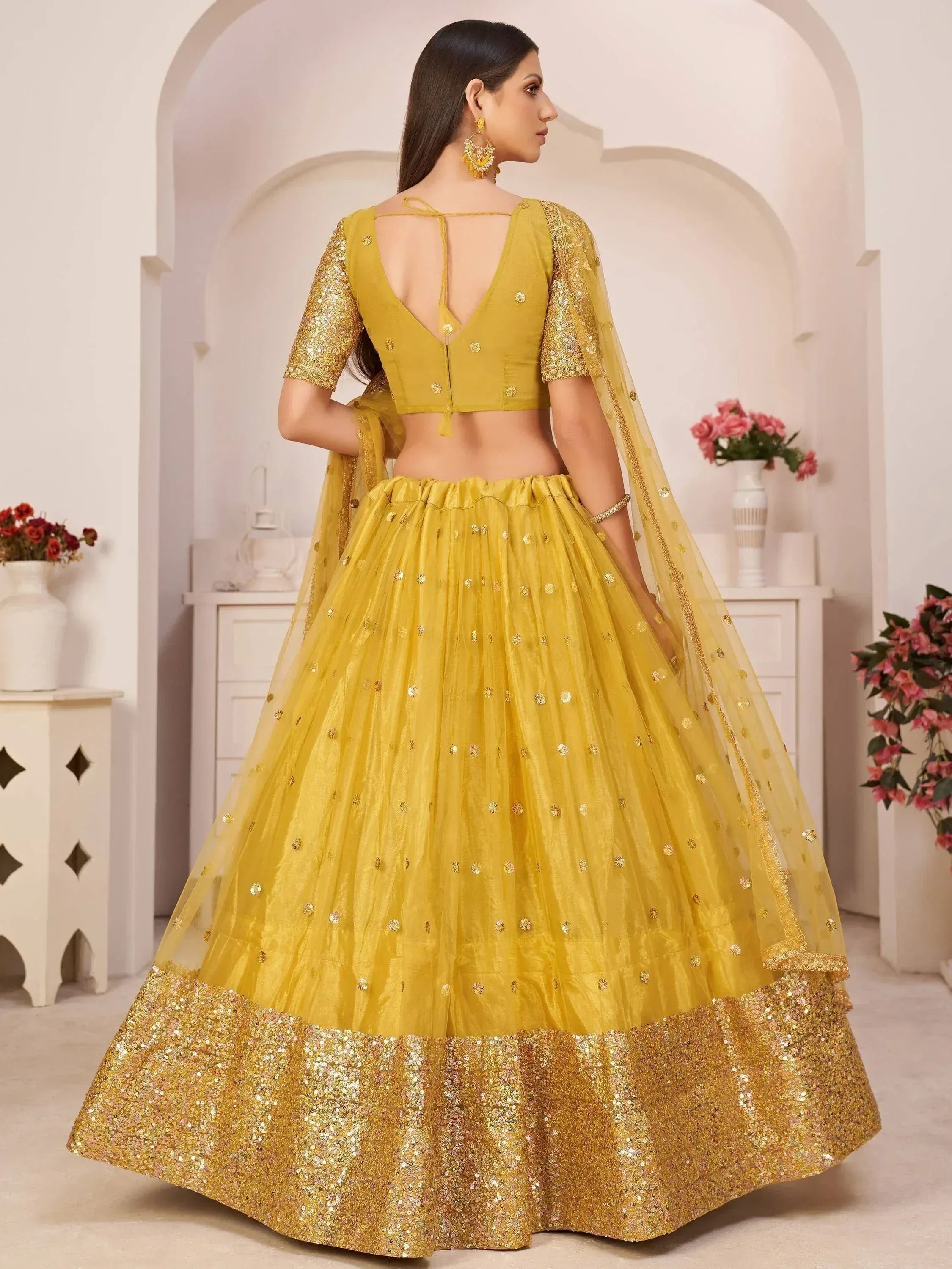 Yellow designer lehenga choli with sequin work and back tie blouse, perfect for Indian ethnic occasions