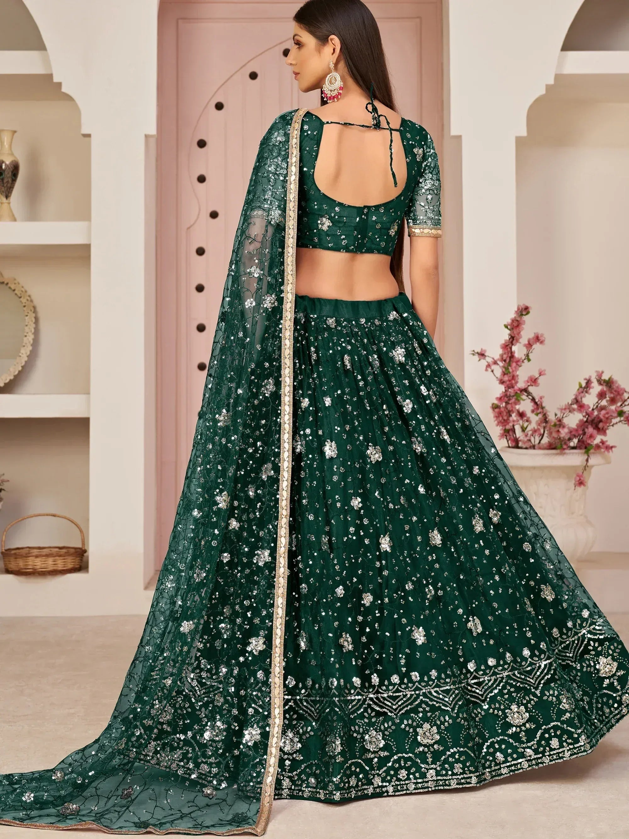 Awesome Bottle Green Sequins Embroidered Net Lehenga Choli