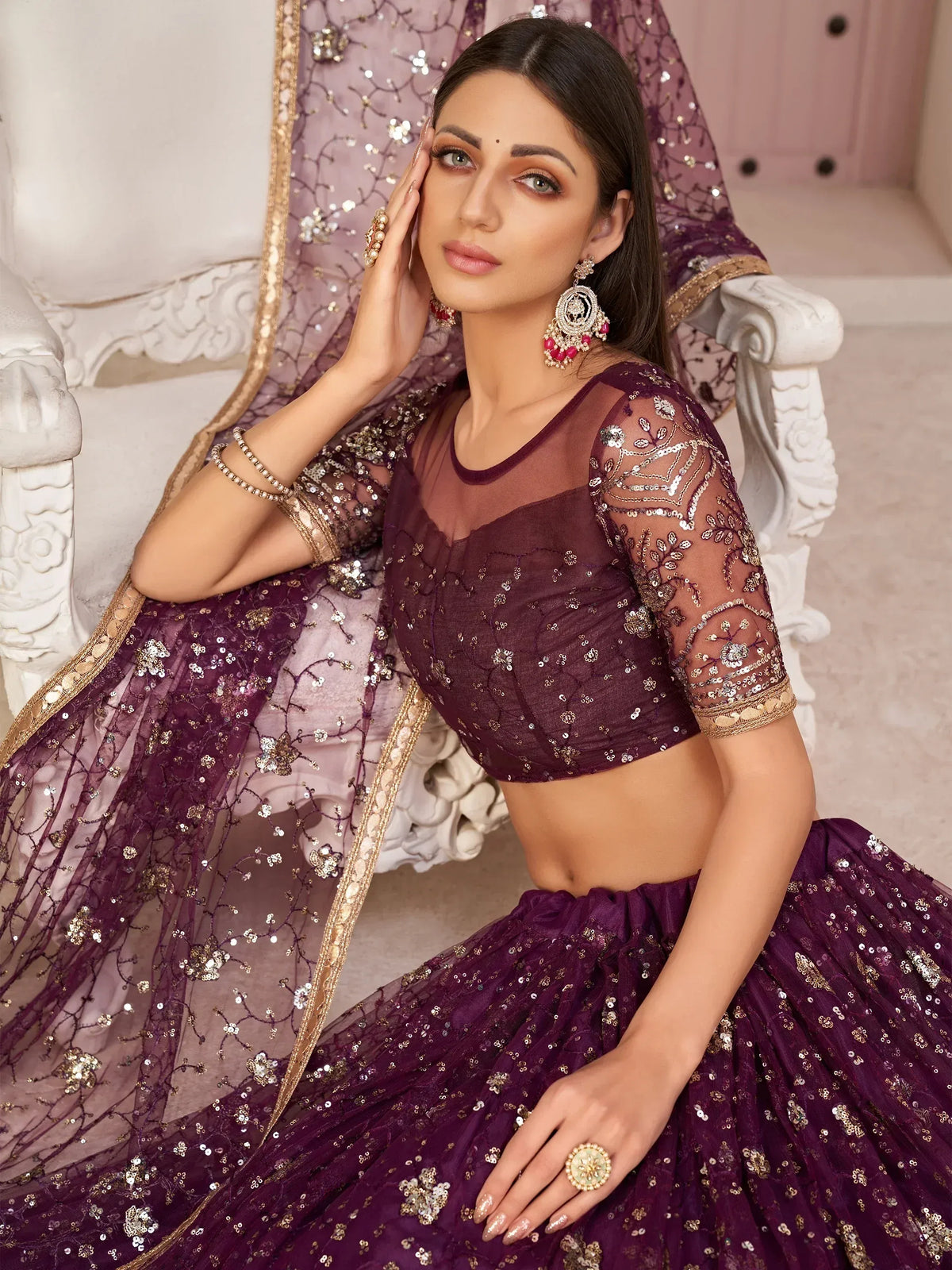 Elegant purple lehenga choli with gold embroidery and sequins, perfect for Indian ethnic wear.