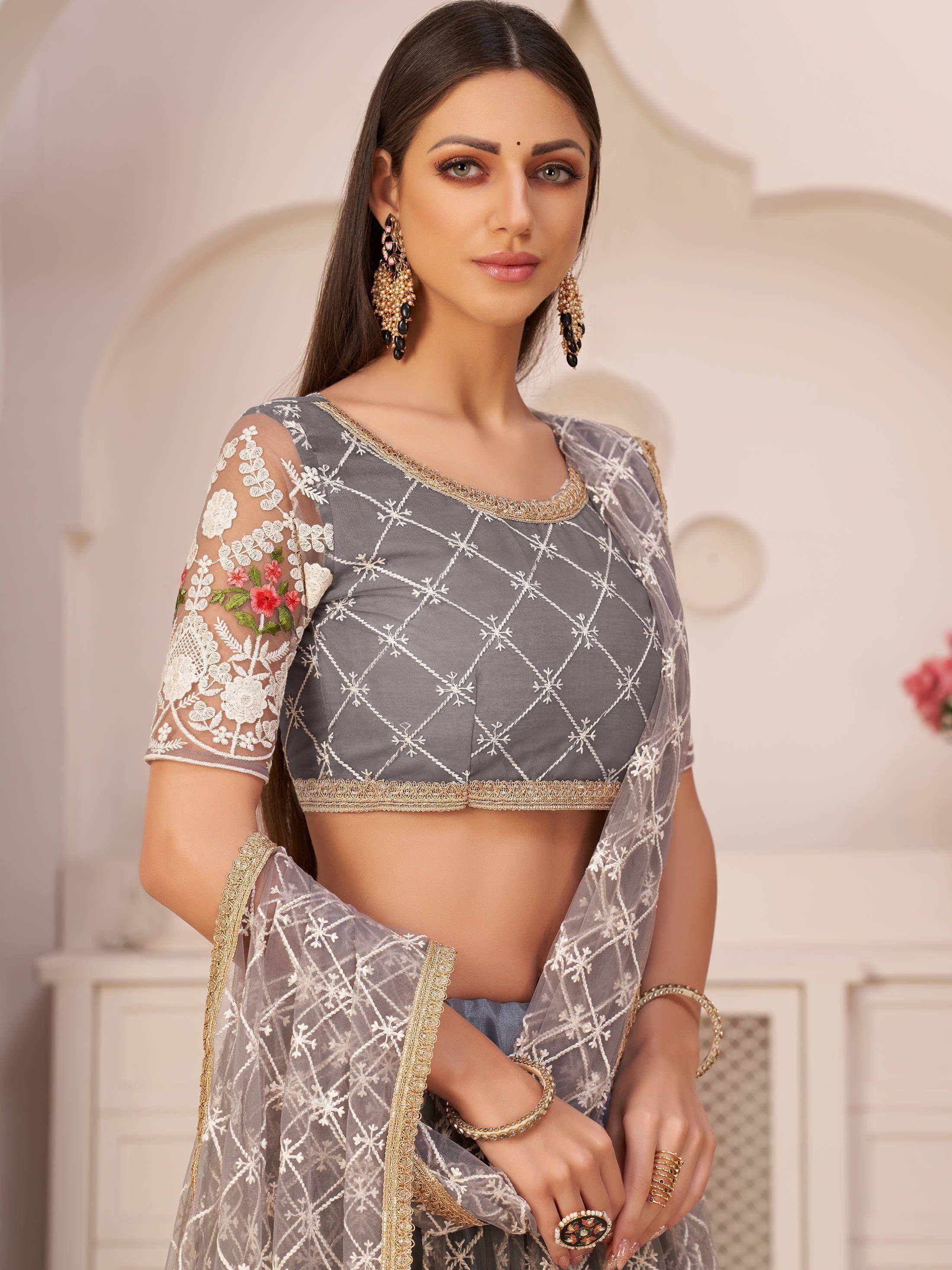 Grey embroidered lehenga choli with floral sleeves and gold trim, perfect for Indian ethnic wear occasions.