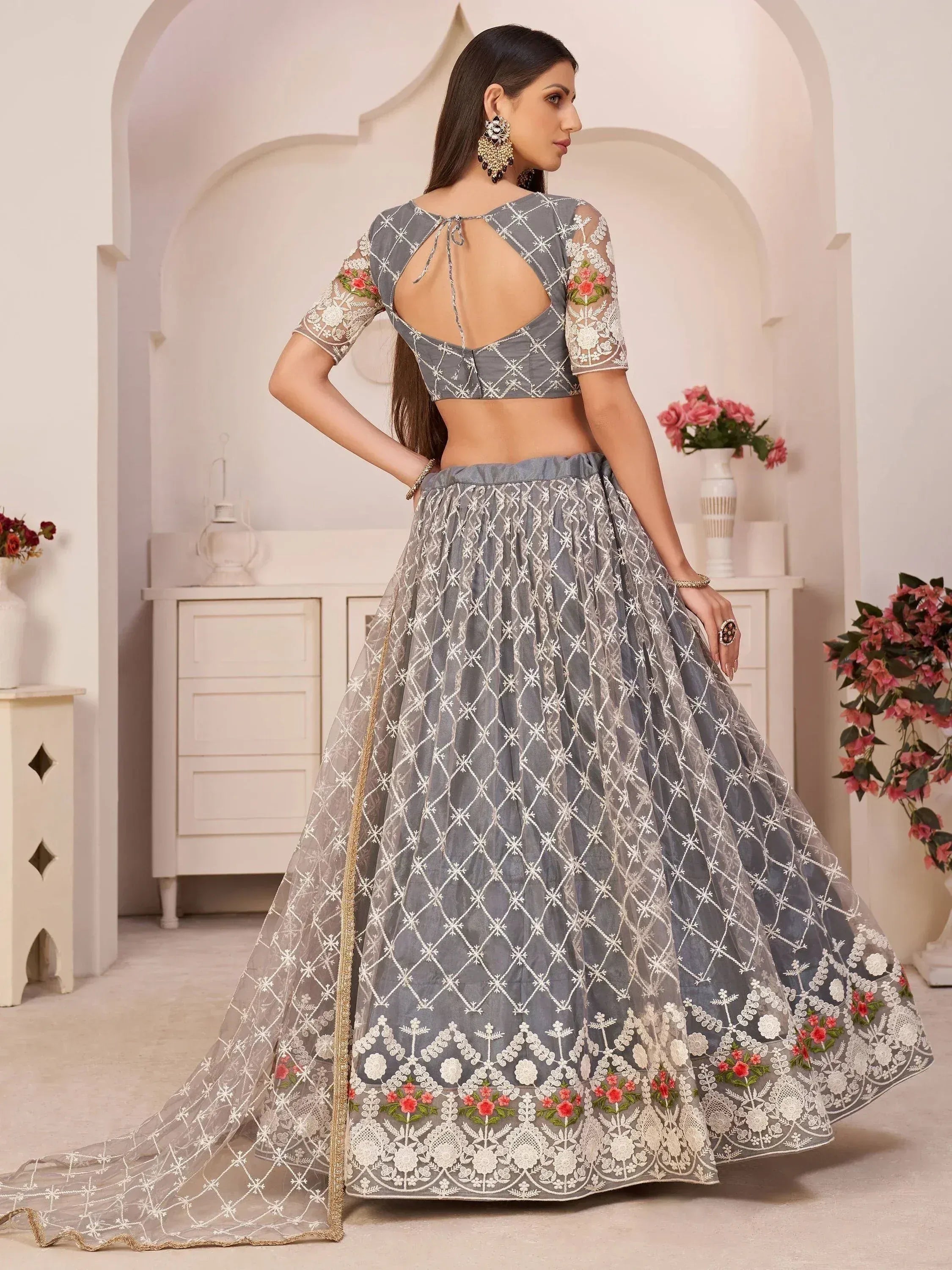 Grey embroidered lehenga choli with floral lace, backless blouse, and sheer dupatta for Indian ethnic wear