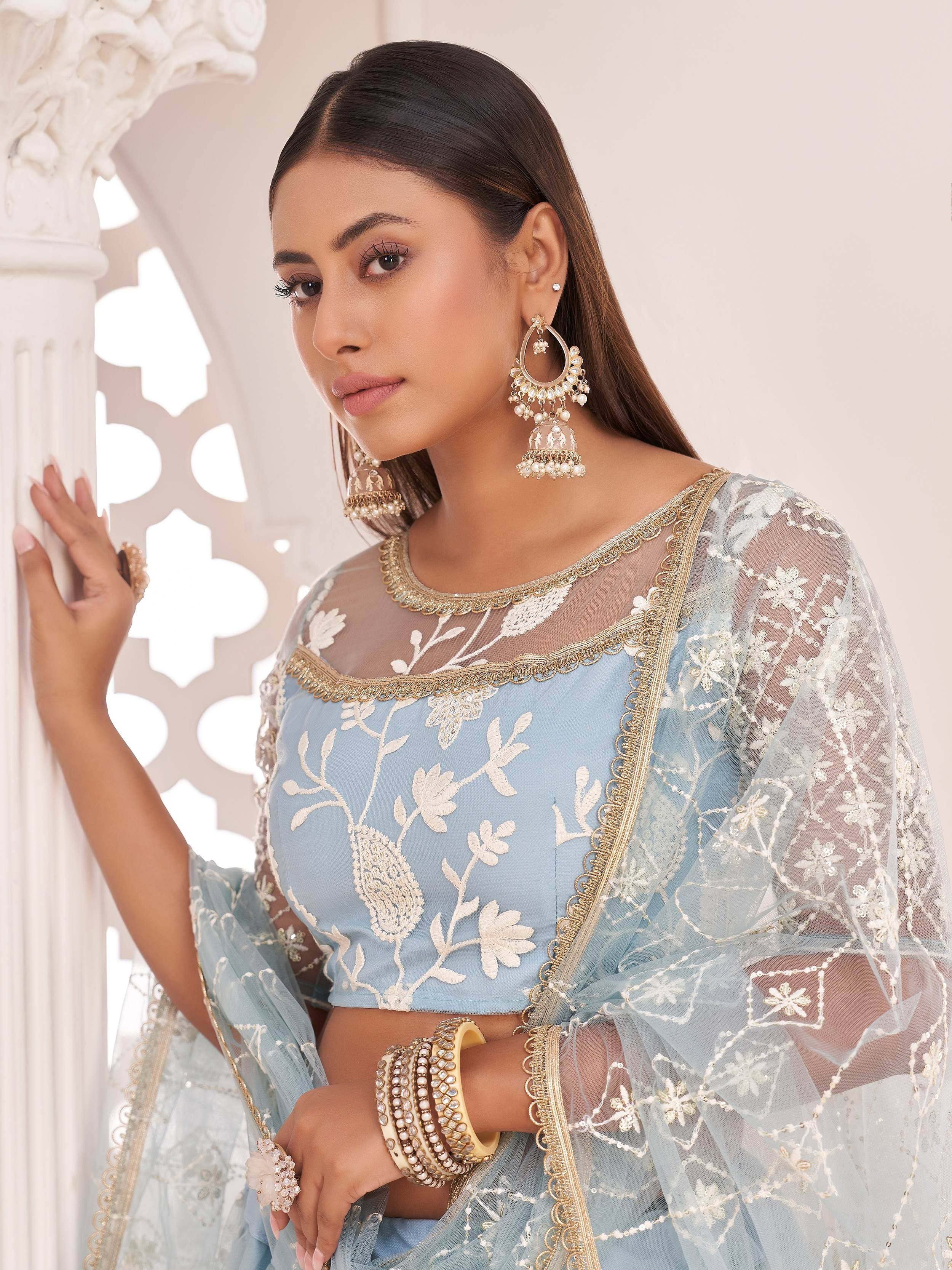 Light blue embroidered lehenga choli with sheer net dupatta and gold detailing, perfect for Indian ethnic wear