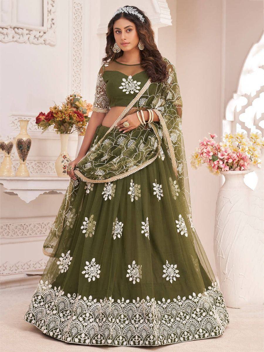 Olive green designer lehenga choli with white floral embroidery and lace border, perfect for Indian weddings and parties.