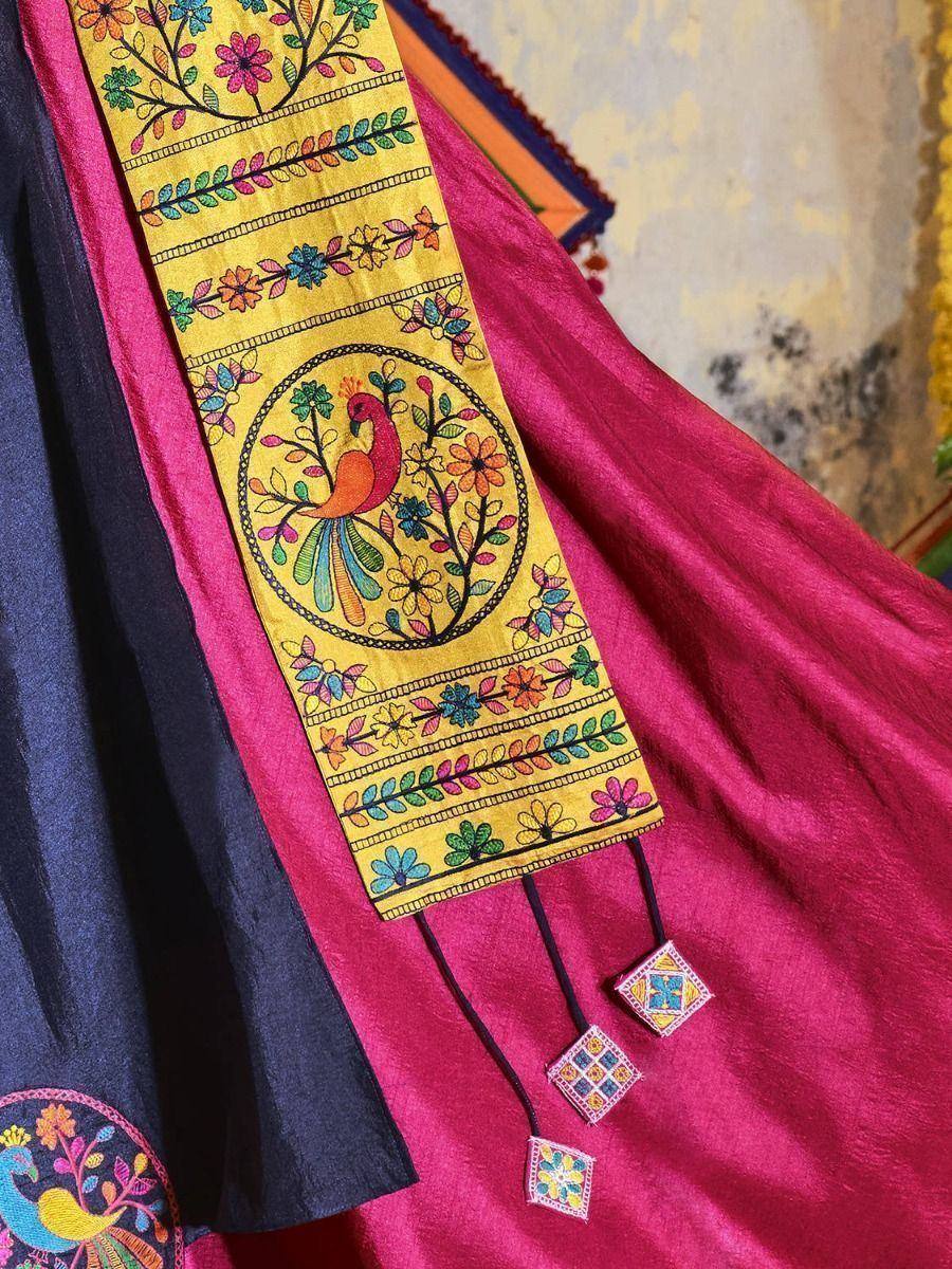 Vibrant yellow dupatta with peacock & floral embroidery, paired with pink and navy ethnic wear