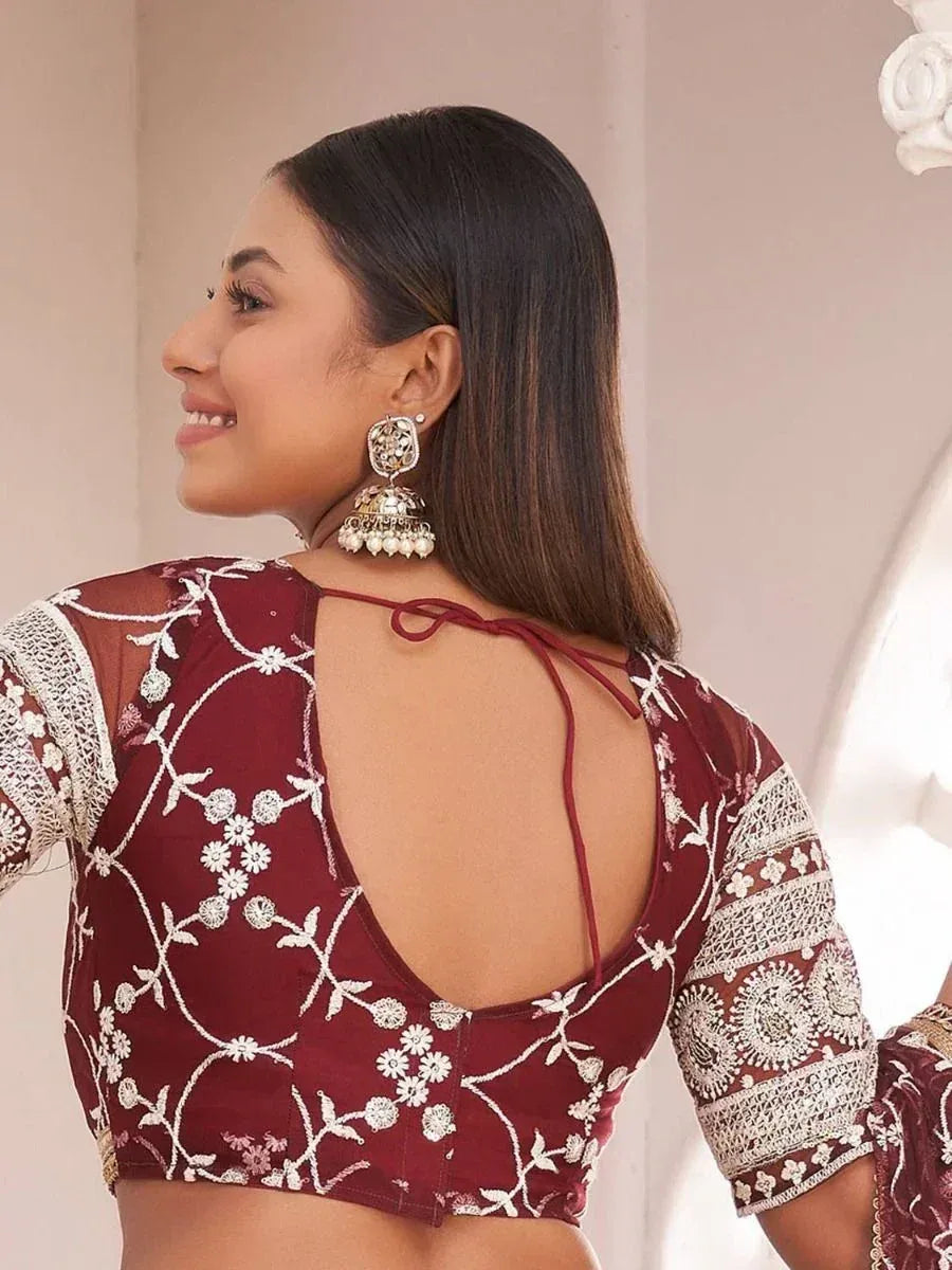 Maroon embroidered lehenga choli blouse with back tie detail and floral lace sleeves